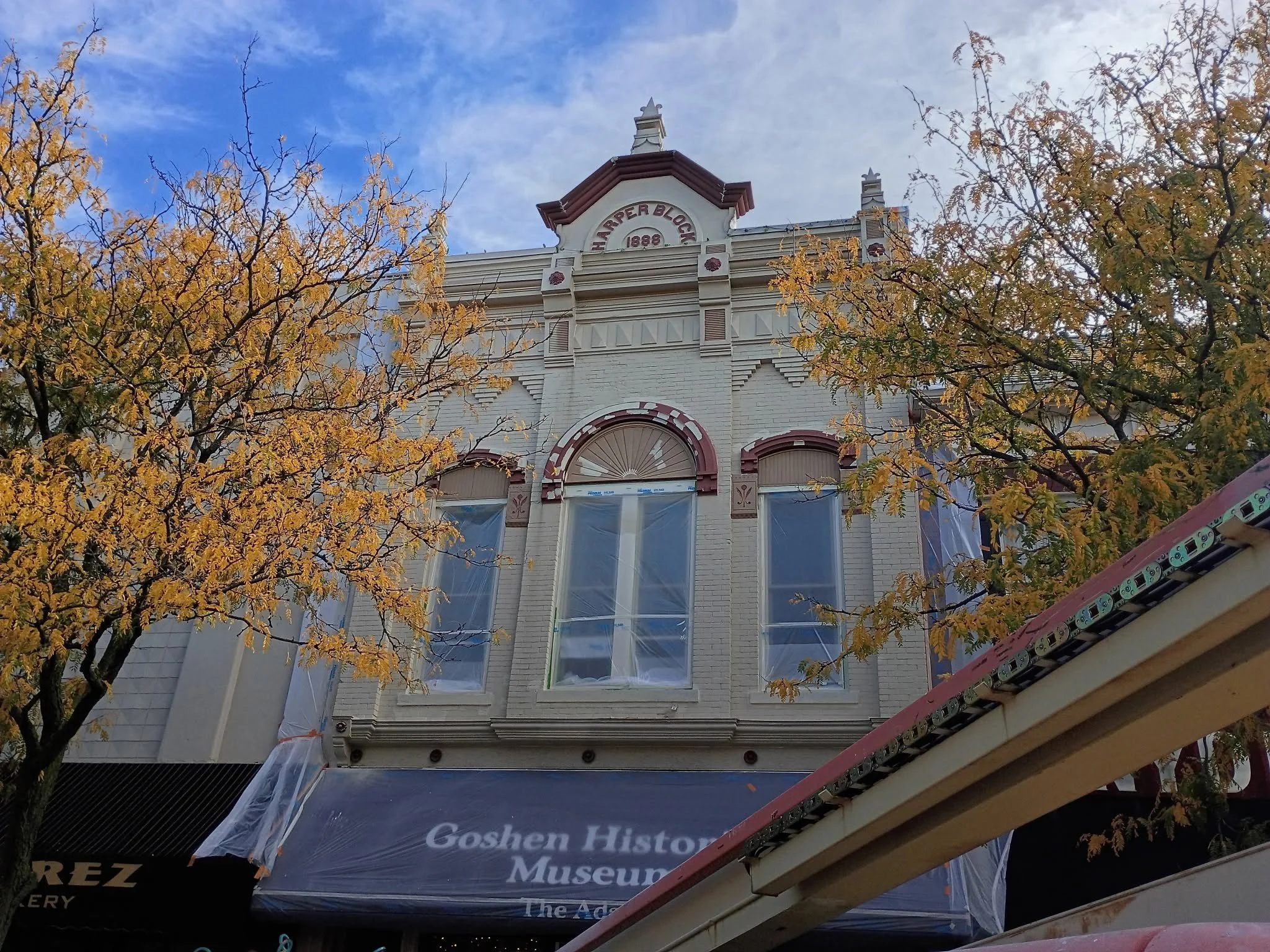 Upper facade and window trim of the Goshen Historical Museum.