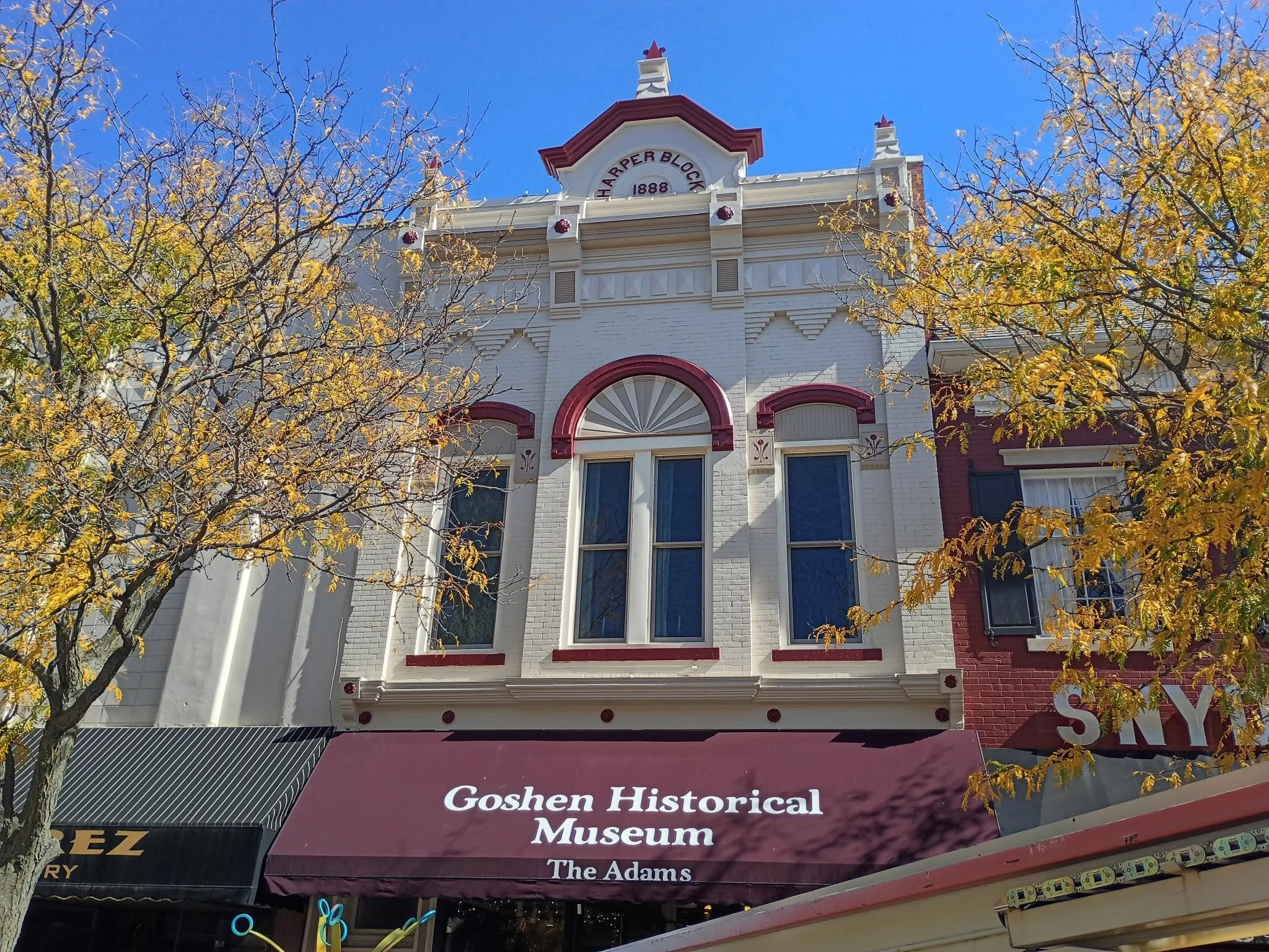 Goshen Historical Museum facade with decorative trim above the entrance awning.