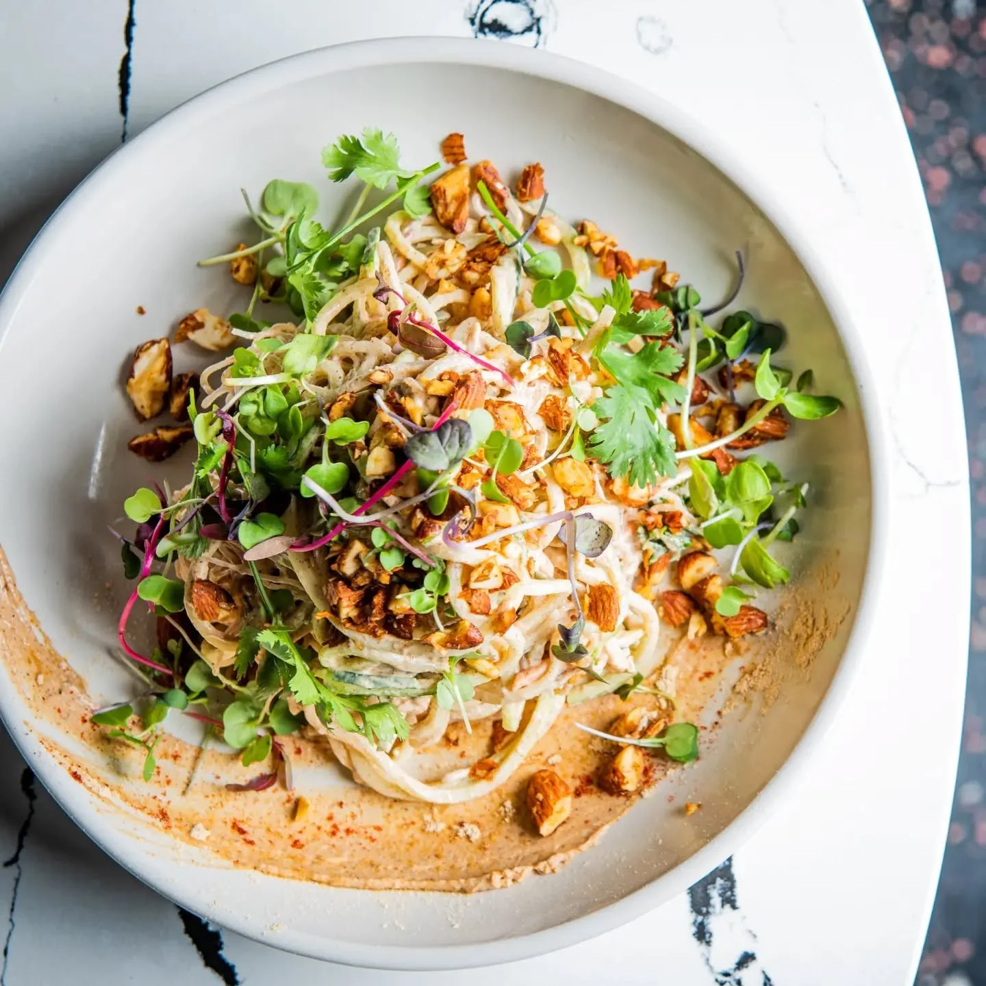 Raw Pad Thai 

A mix of Zucchini and Kelp Noodles Tossed in a Maca Infused Almond Butter Cream Sauce 

Marinated Vegetables, Activated Chili Crusted Almond Clusters 

#rawfood #plantbasedfood