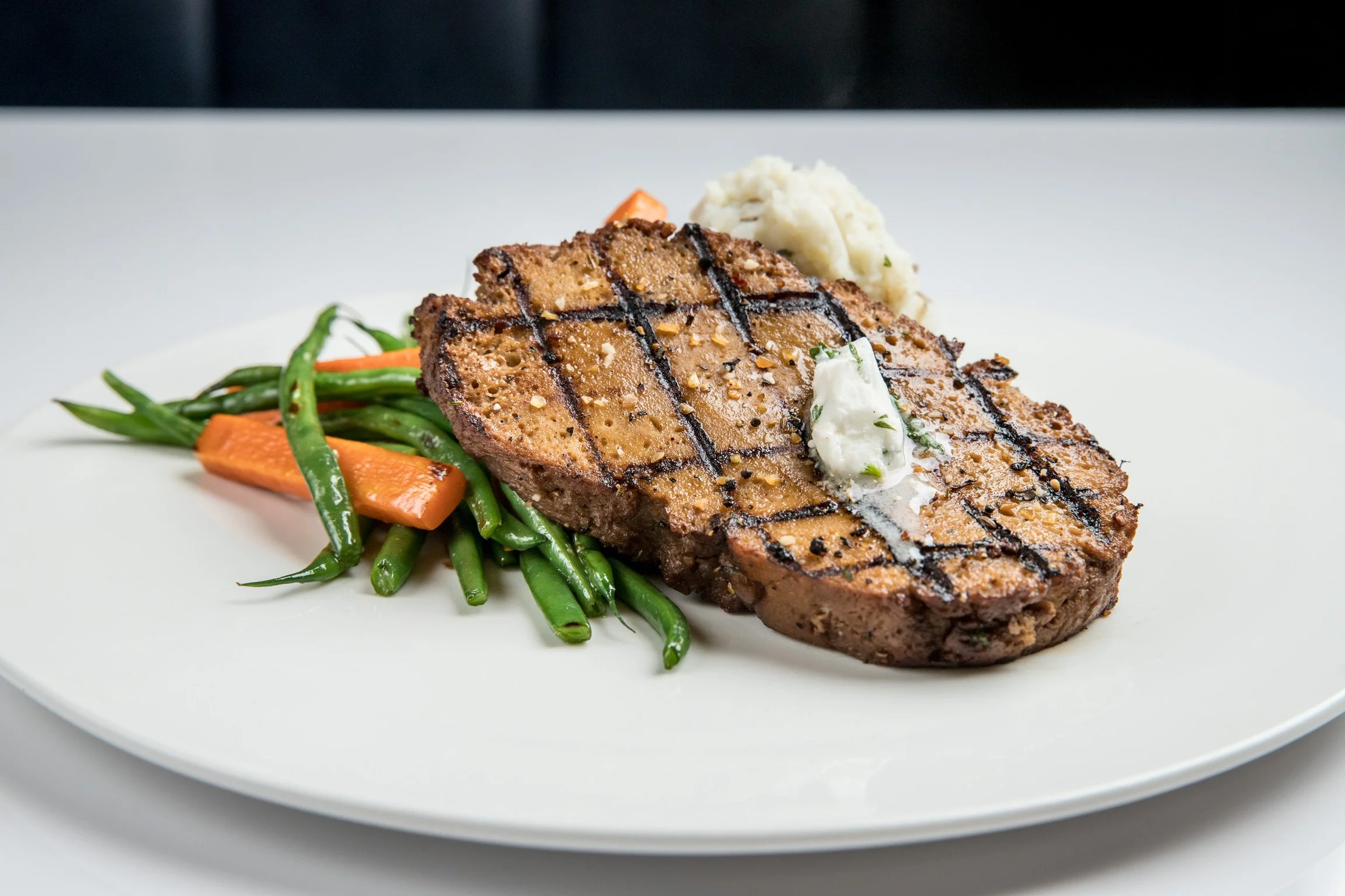 SEITAN. You either love it or hate it.

Me? I LOVE IT.

This NY Striploin was marinated HARD &mdash; red wine, tamari, Dijon, nooch, garlic + thyme &mdash; then hit a screaming-hot grill for that deep, smoky char served at Mythology Diner 

Some hate