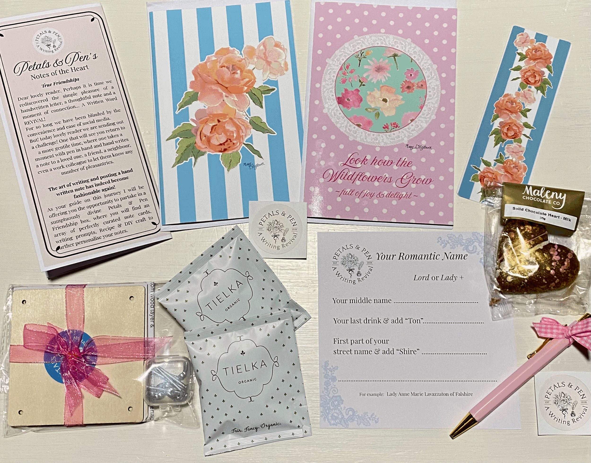 Petals & Pen romantic friendship gift box by Missy Wildflower, featuring floral stationery, handwritten letter-writing prompts, a pink pen, women's gift, artisan tea, Maleny chocolate heart