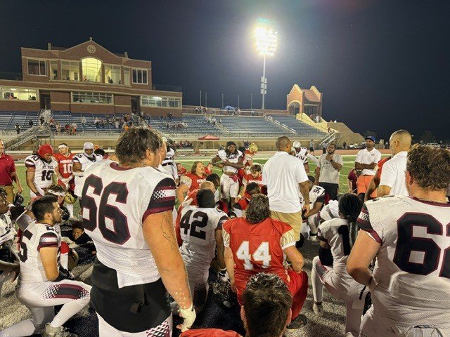 Group meeting and prayer post game following the Miners vs Pioneers game on June 14th, 2025