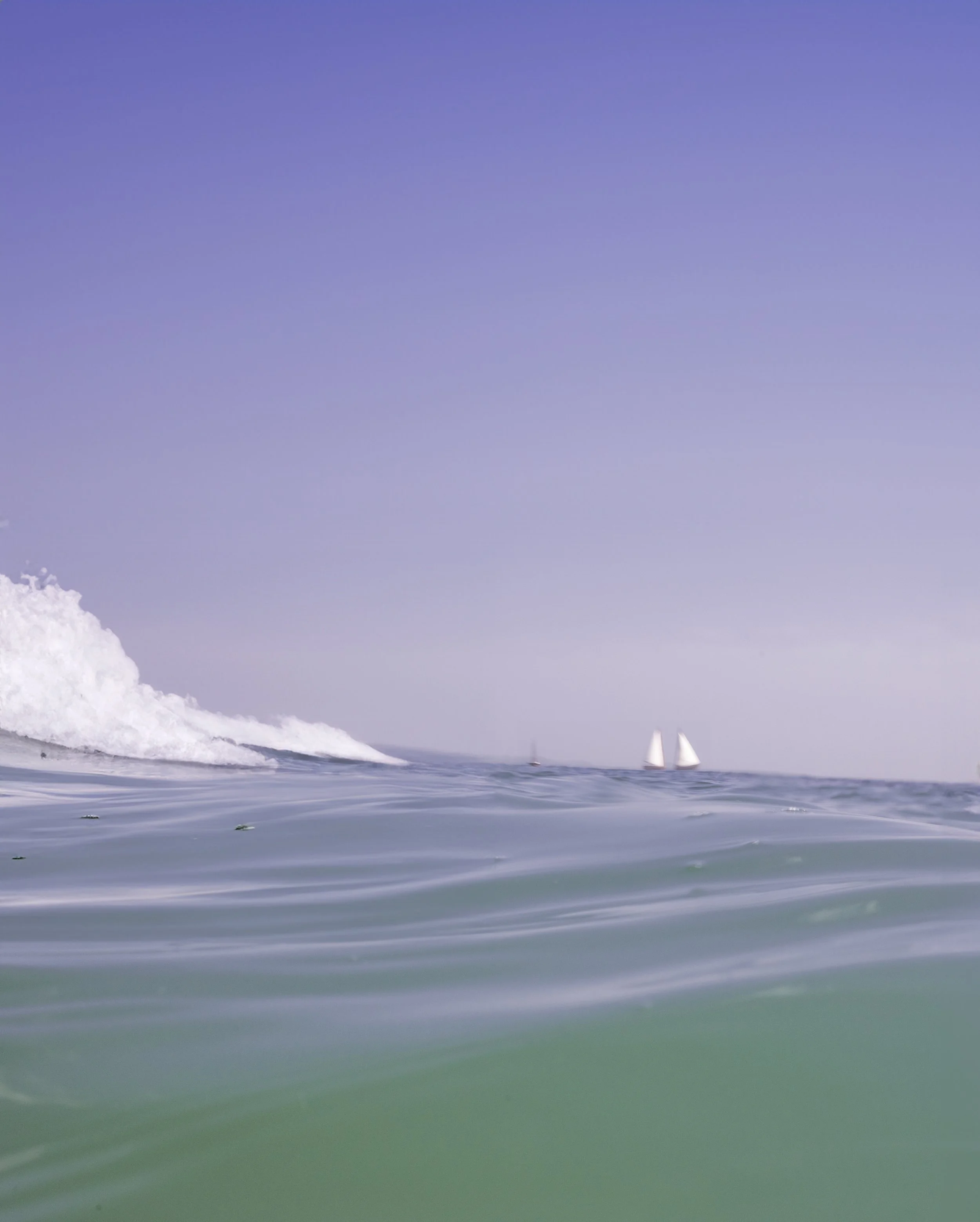 TWO SAILBOATS AND A WAVE.jpg