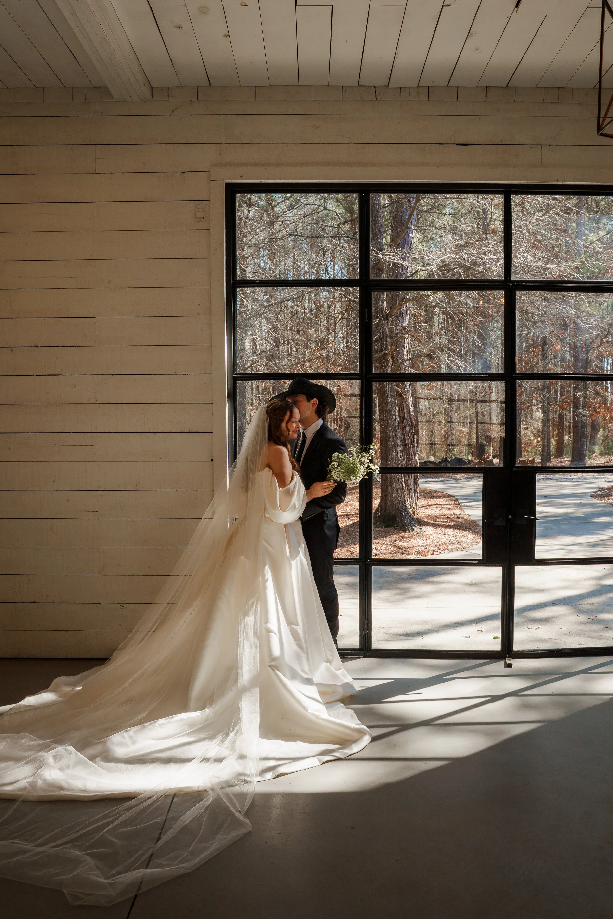 Bride and Groom having a private moment in their reception space