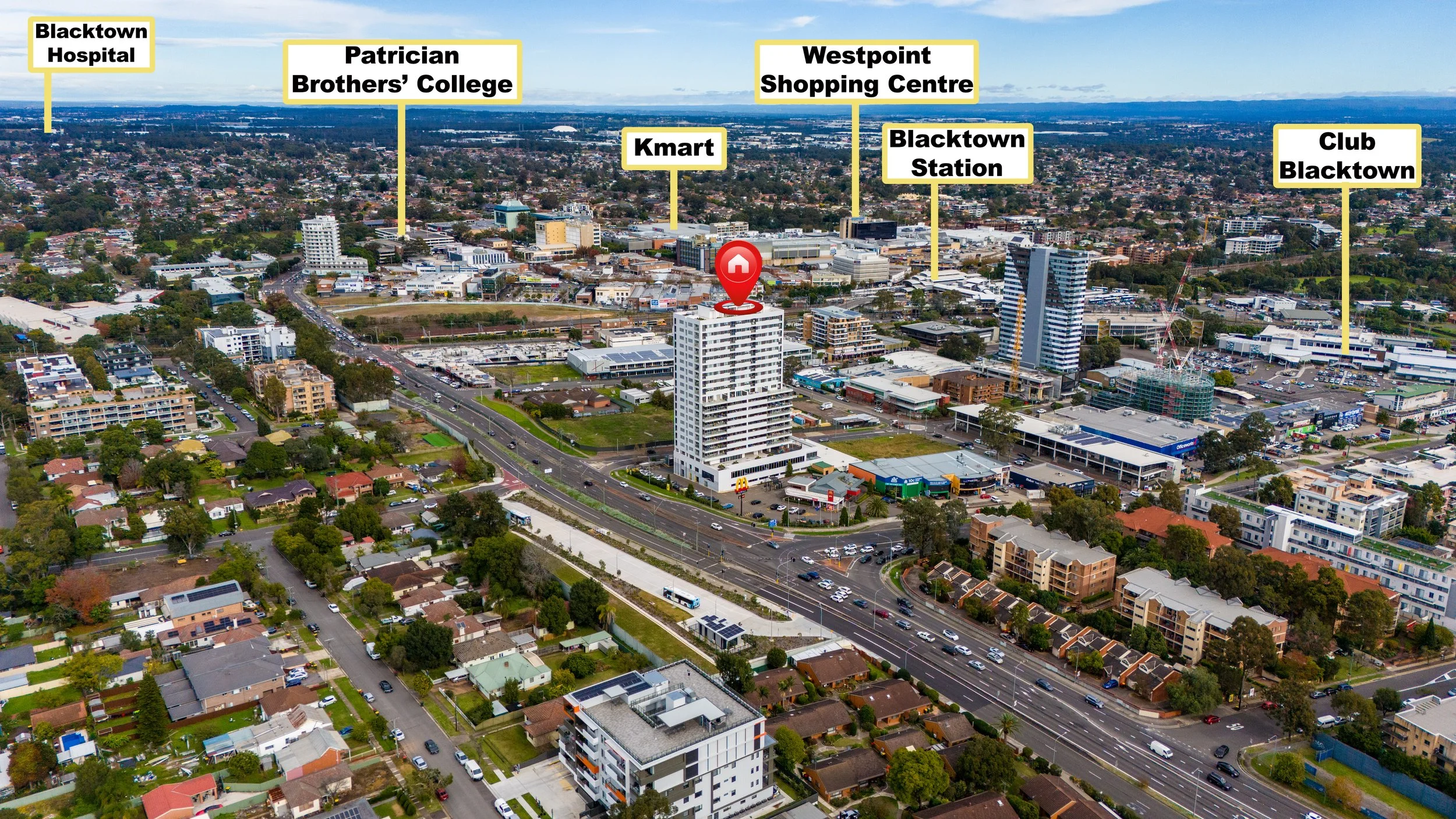 Aerial view of a cityscape showing a mix of residential and commercial buildings with labels indicating nearby landmarks such as Blacktown Hospital, Patrician Brothers' College, Westpoint Shopping Centre, Blacktown Station, Club Blacktown, and a cent