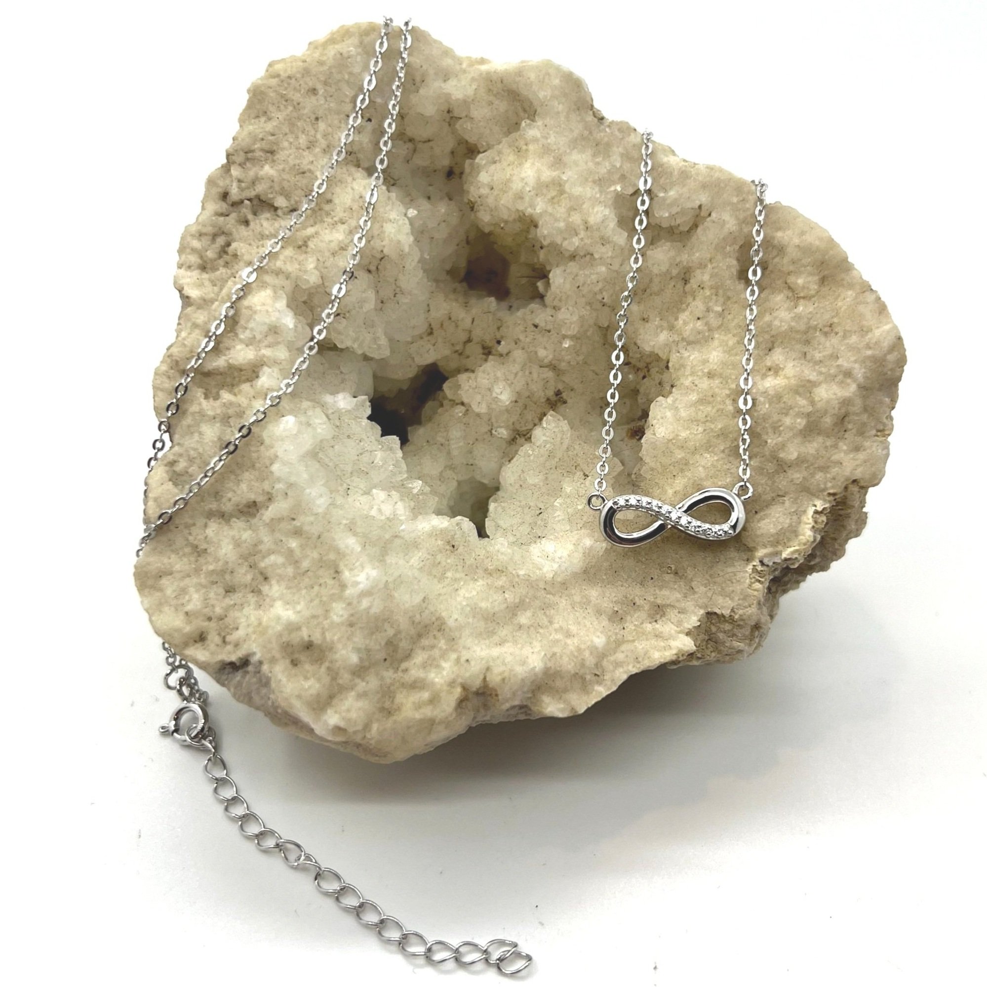 Geode with frequency infused grounding jewelry, Love Infinity Necklace.