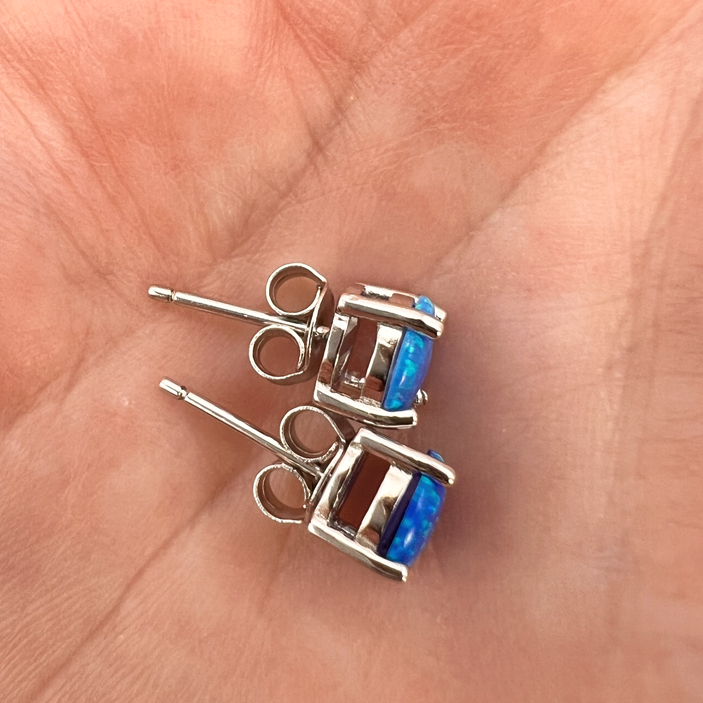 Blue Opal Stud Earrings on Hand
