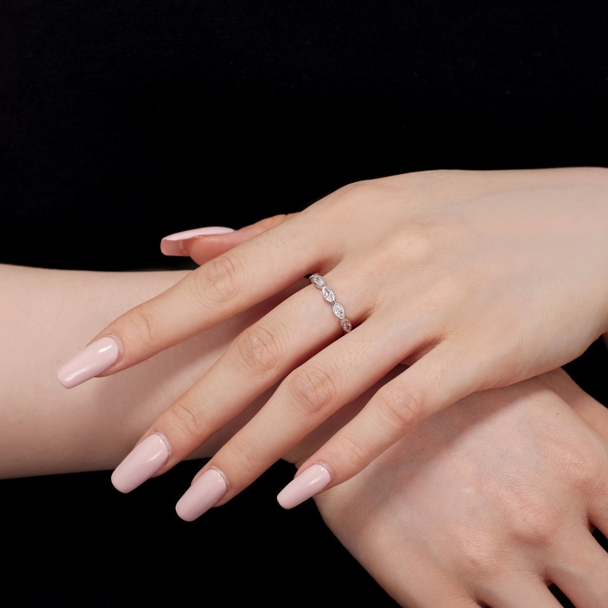 crossed-handing-zircon-eternity-ring.jpg