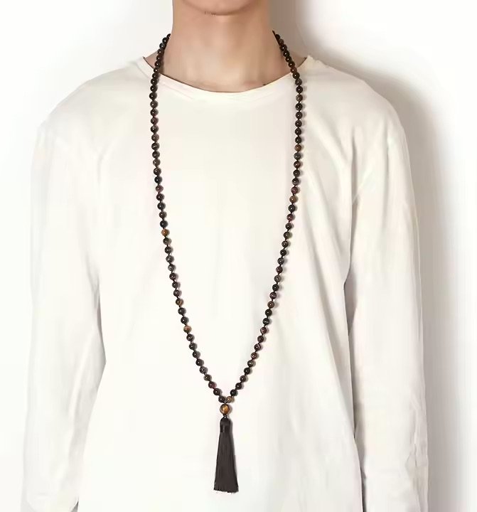 Person wearing the grounding energy Mala necklace.