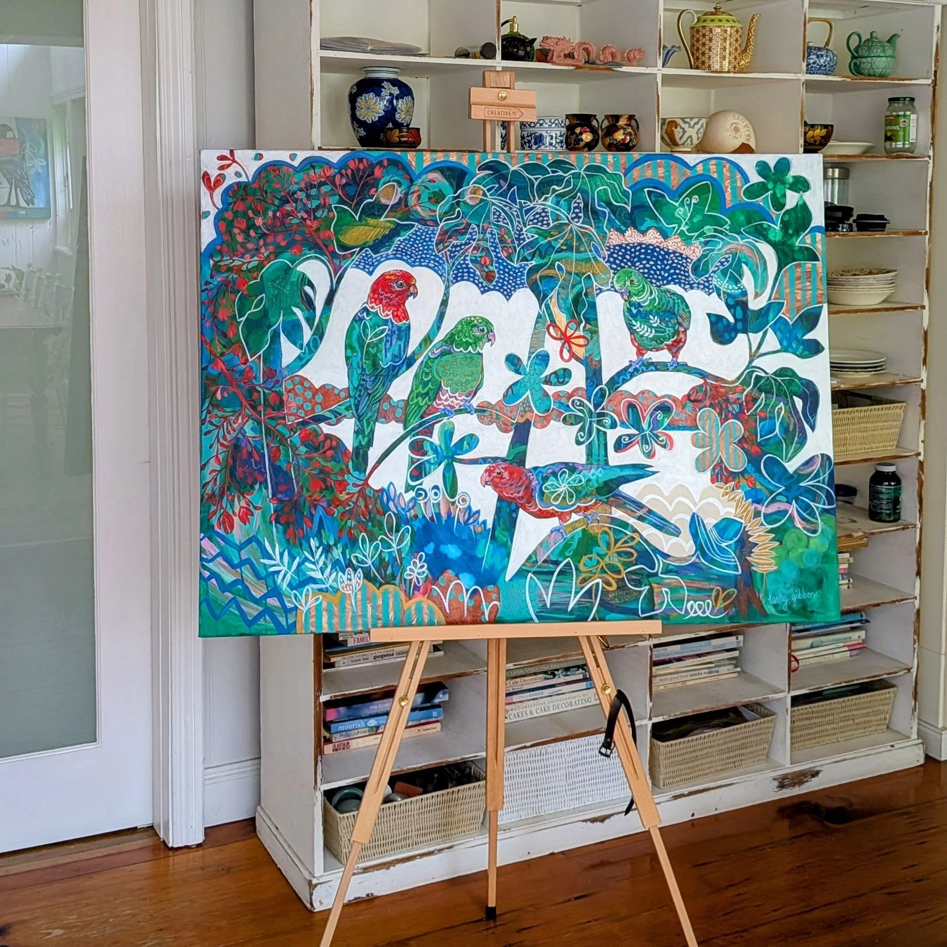 New abstract king parrot bird painting in styled setting with decorative shelving background.jpg