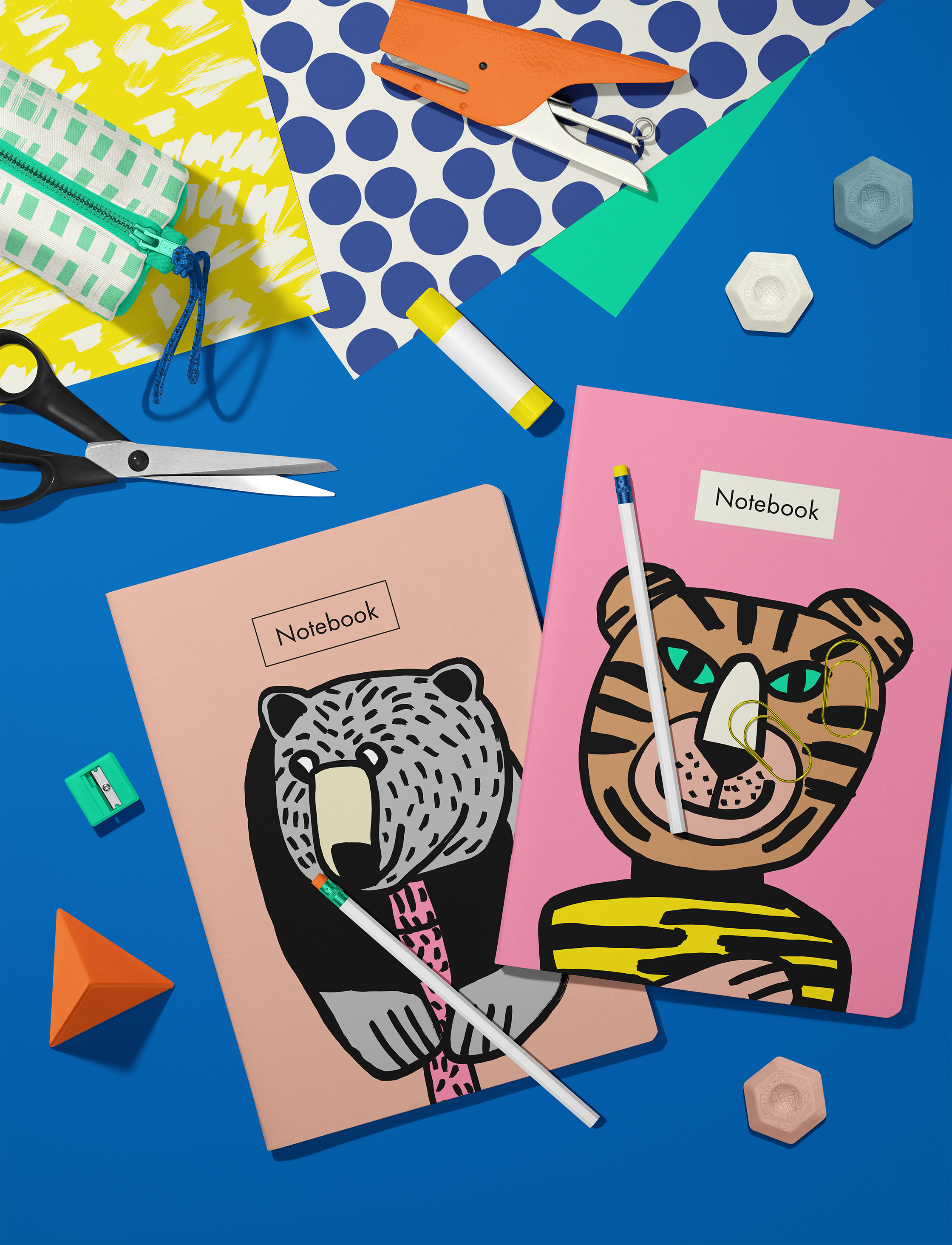 Colorful drawing of a bear and a tiger , notebooks and stationary items, design by Sarah Corynen.