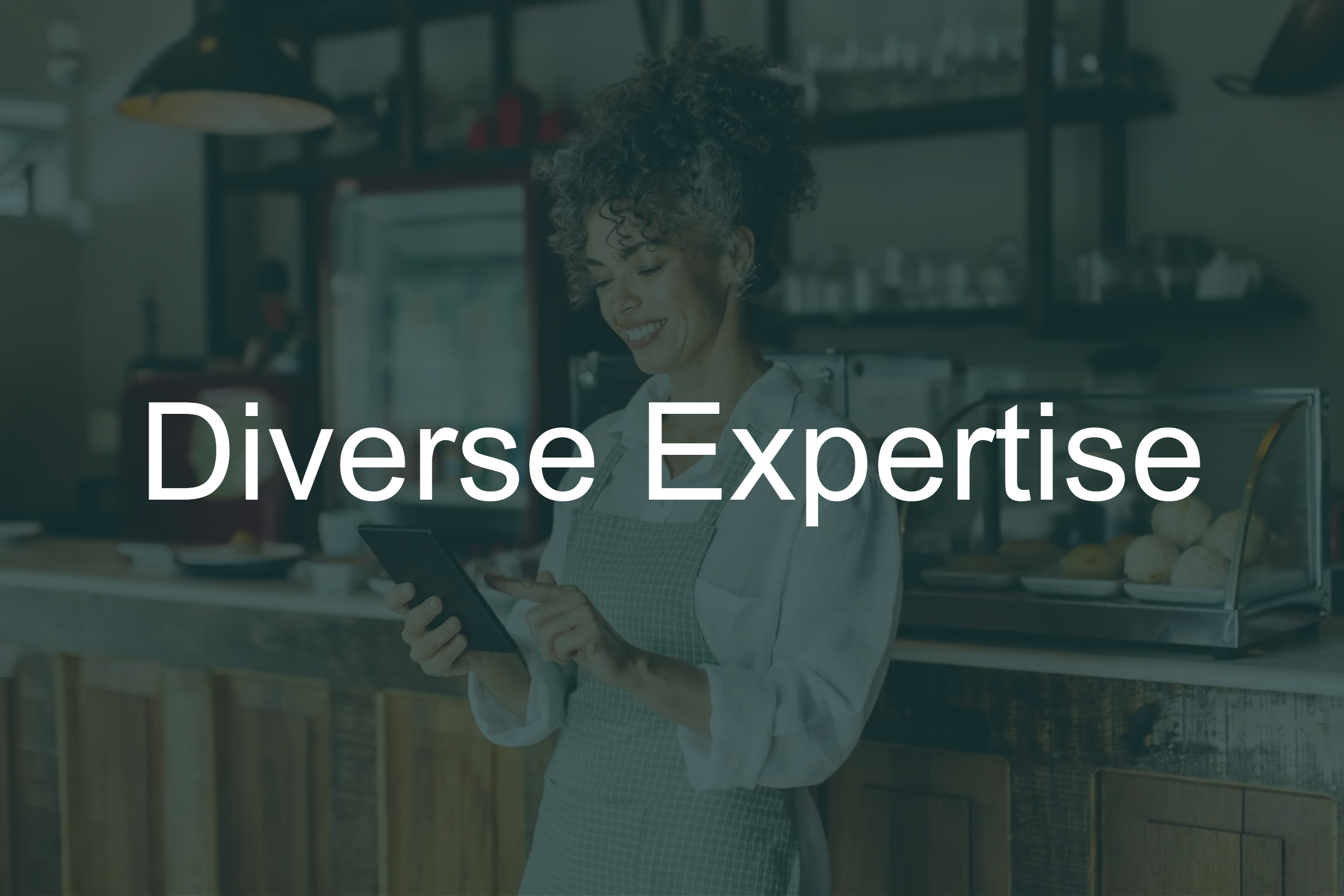 A woman with curly hair looking at a tablet in a bakery or cafe, with shelves of baked goods and glassware in the background, and the text 'Diverse Expertise' overlaid.