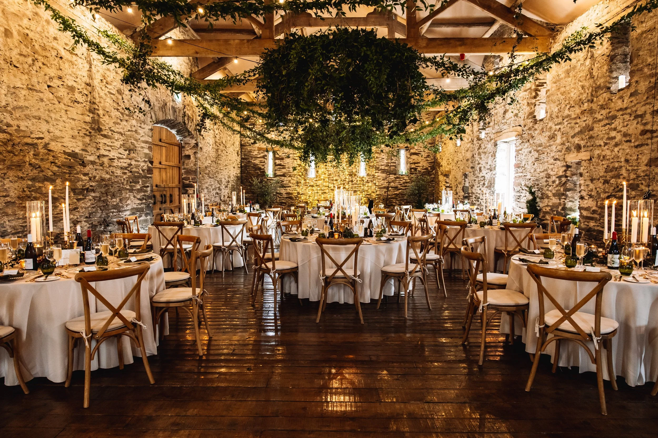 barn-in-the-fells-reception-fairy-light-backdrop-candles-flowers-mediterranean-lanterns-wedding-styling-prop-hire-deborah-maria