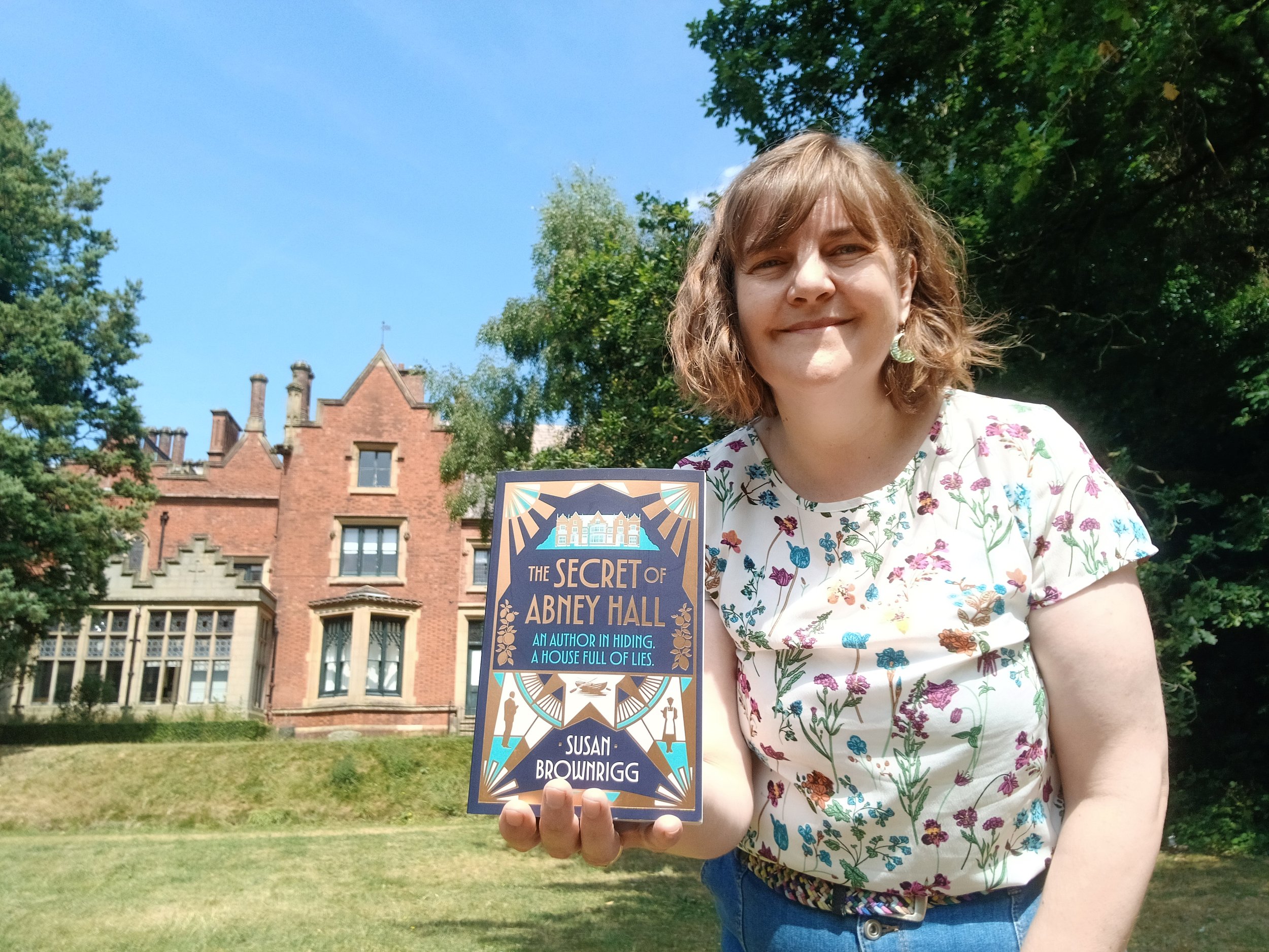 Landscape Susan Brownrigg with book at Abney Hall.jpg