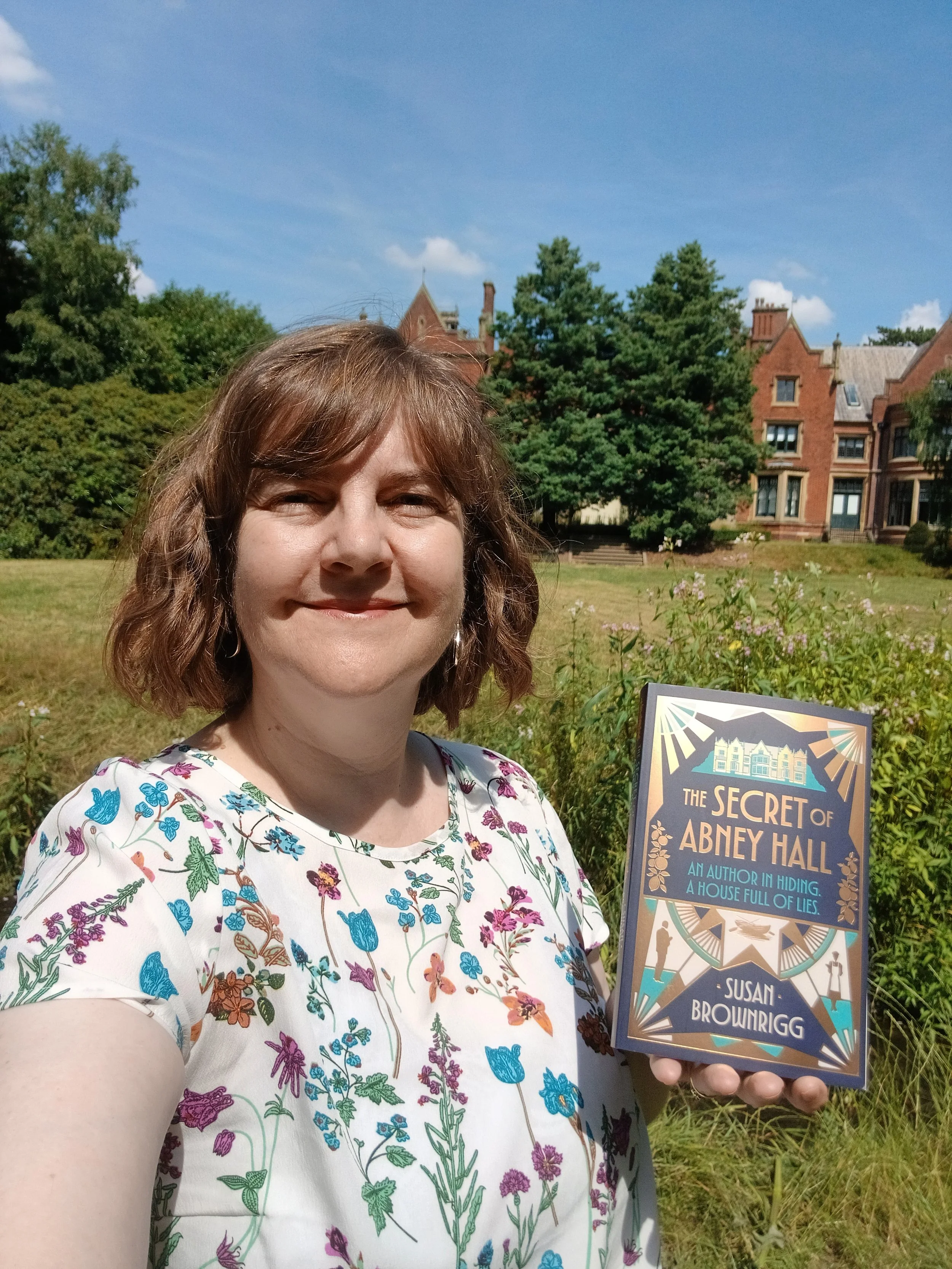 Portrait image Susan Brownrigg and book at Abney Hall.jpg