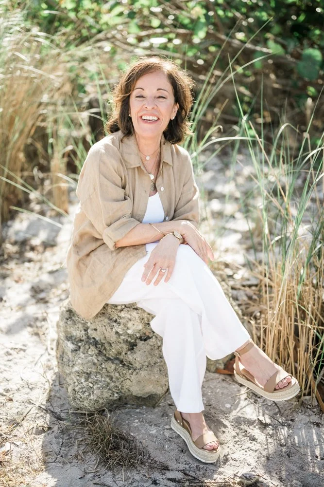 Helena laughing during her outdoor headshot session with Kristine Casart