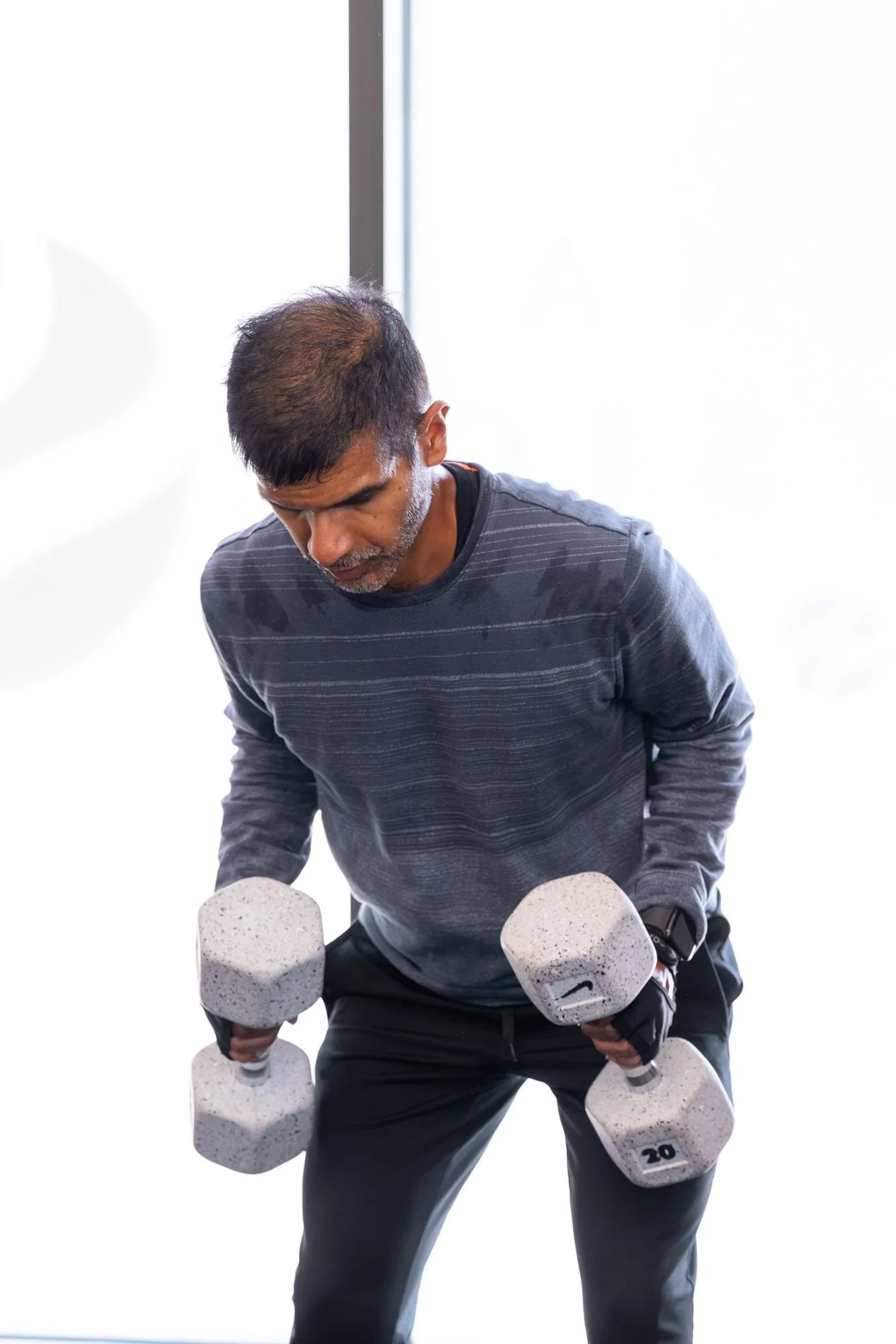 A member doing a dumbbell row