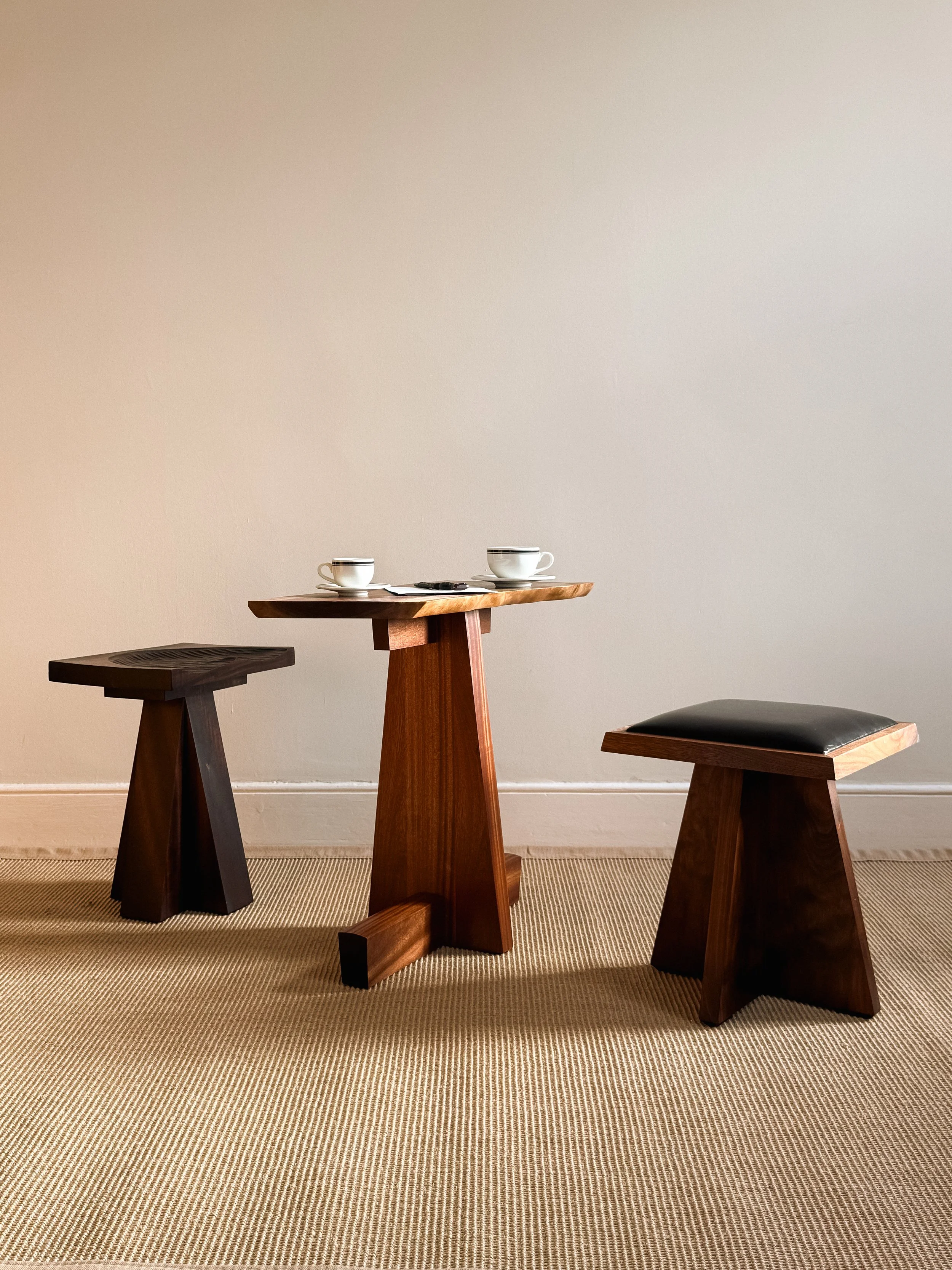 George Side Table, Praetorian Carved & Leather Stools, 2026.