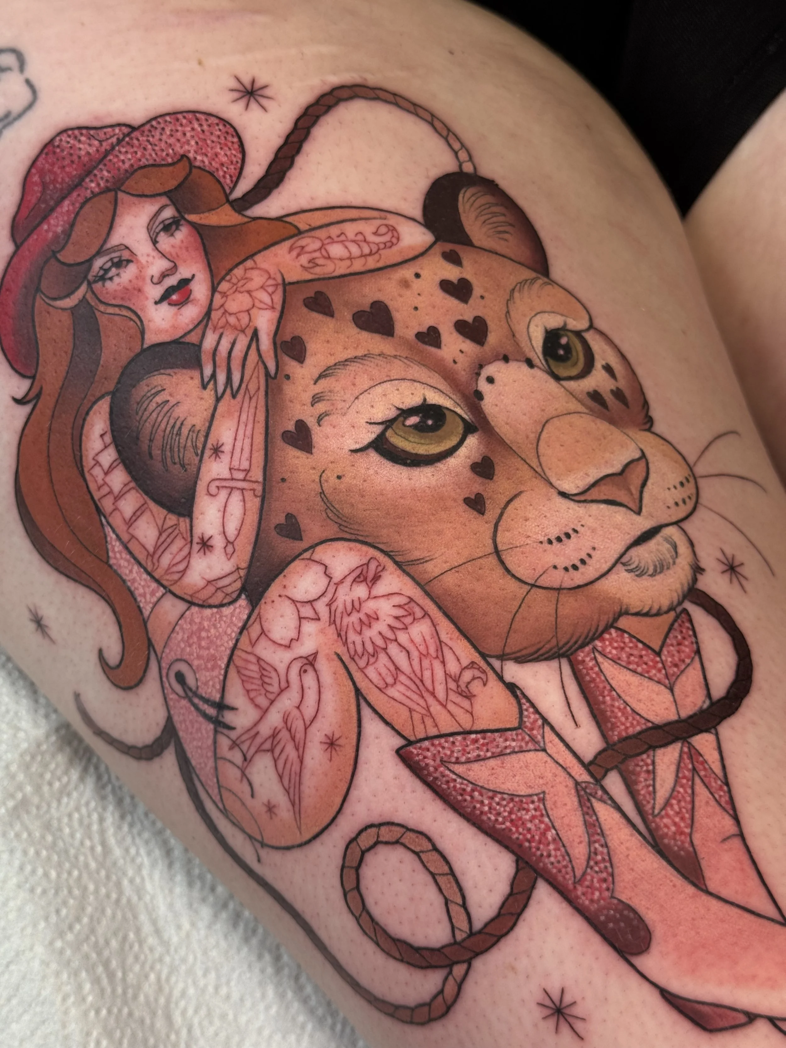 Neotraditional cowgirl pin-up tattoo with glitter and leopard