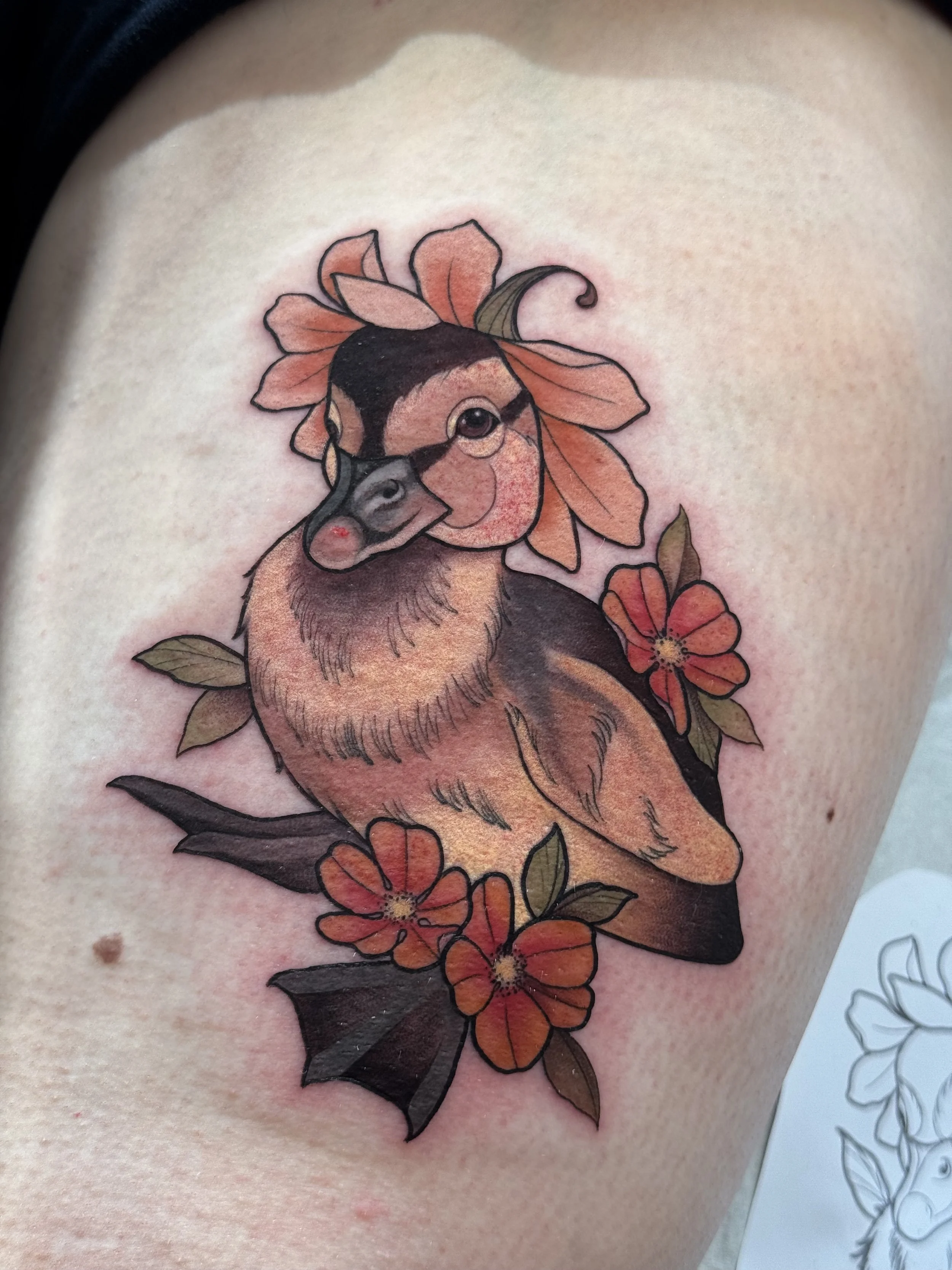 Cute whimsical cottage core duckling with flowers neotraditional tattoo