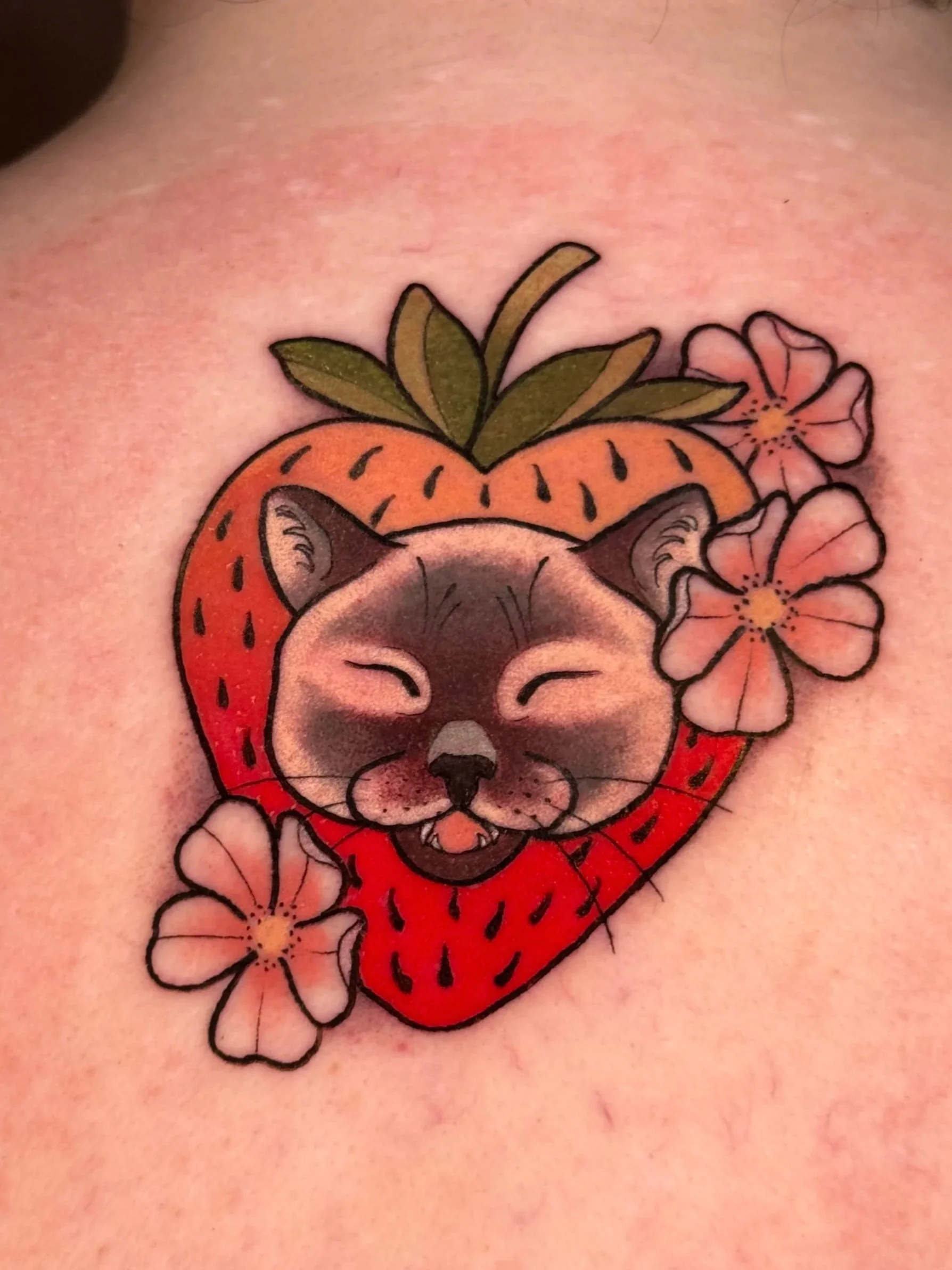 color tattoo of a kitty in a strawberry, neotraditional/illustrative