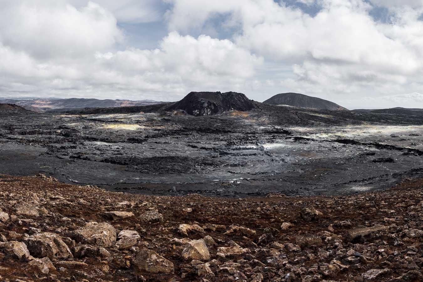  The dramatic crater of the  Fagradalsfjall  volcano surrounded by hardened lava fields. 