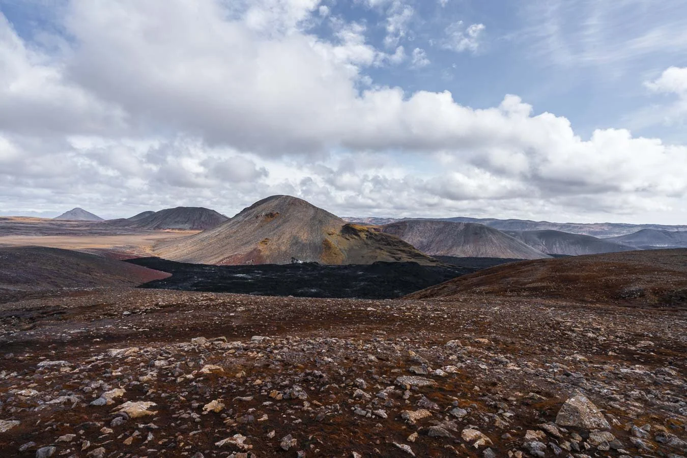   Fagradalsfjall  is one of Iceland's youngest volcanoes. It has been erupting frequently in recent years—almost annually—drawing visitors to witness its dramatic lava flows and vibrant volcanic activity. Unfortunately, our time in Iceland (2023) did