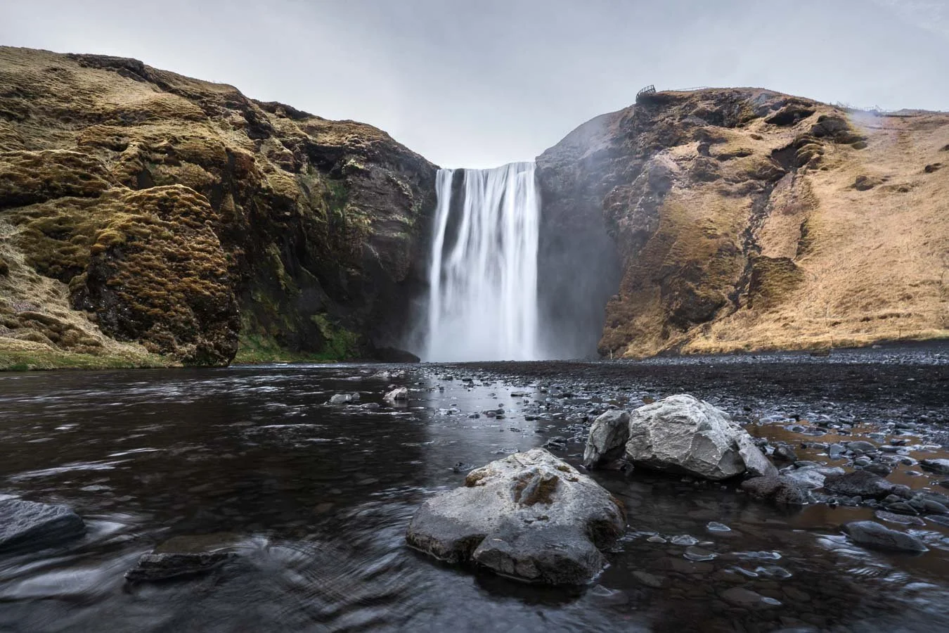   Skógafoss , Iceland’s iconic 60-meter waterfall, is said to hide a Viking treasure behind its powerful cascade. 