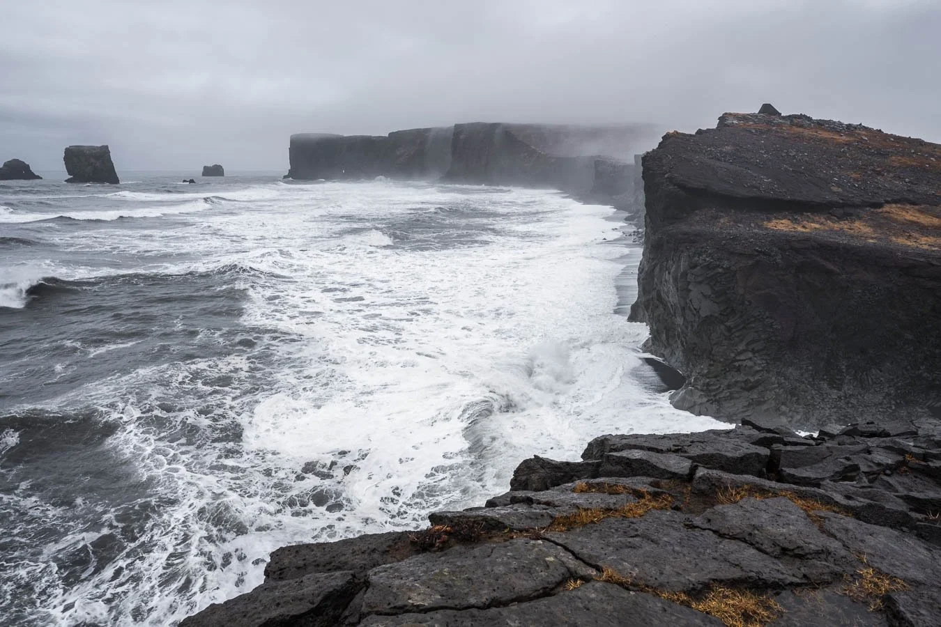  The steep cliffs of  Reynisfjara  are carved by relentless Atlantic waves and serve as a summer nesting ground for puffins and other seabirds. 