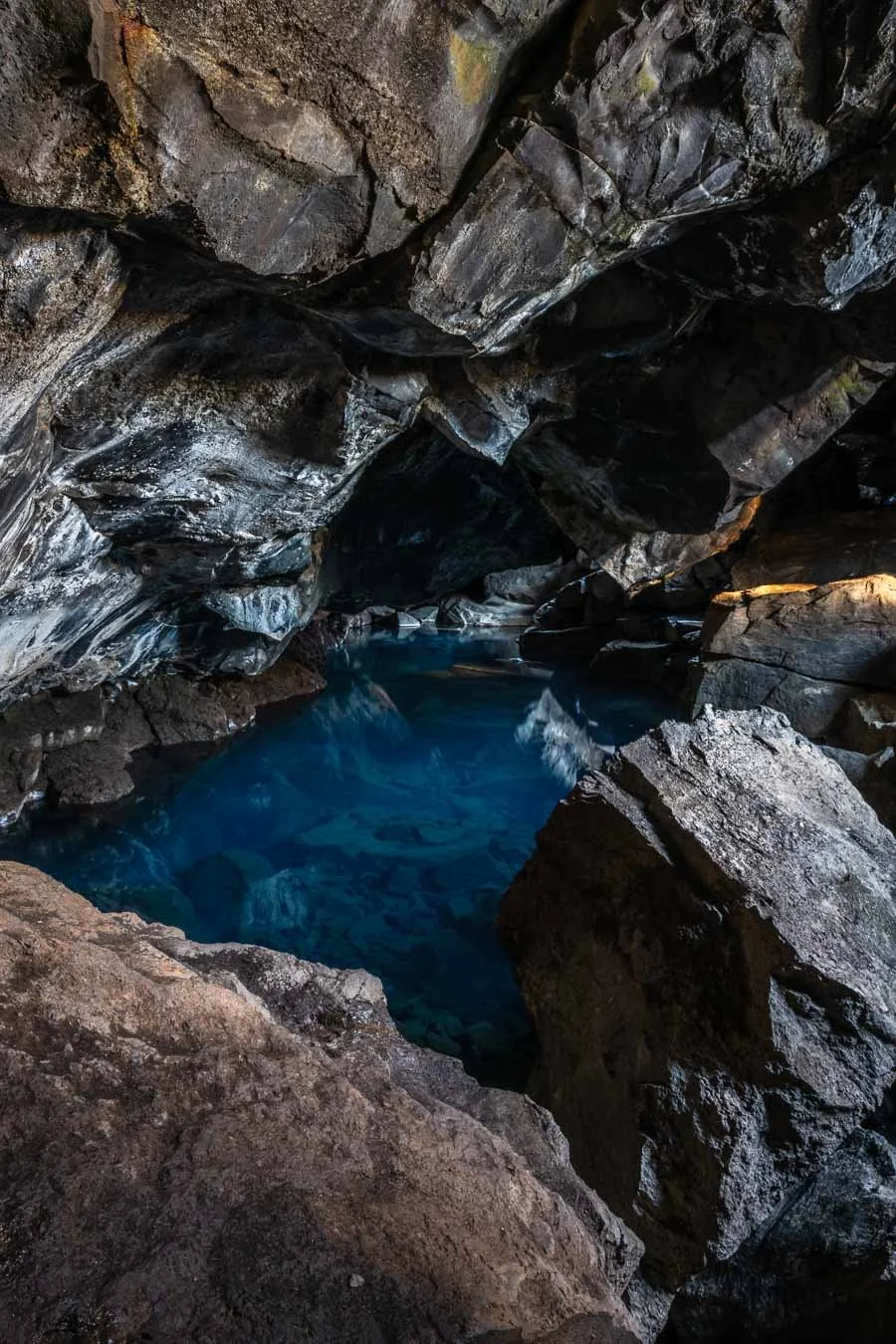   Grjótagjá  is a small lava cave near  Lake Mývatn , renowned for its crystal-clear geothermal hot springs that once served as a popular bathing spot. 