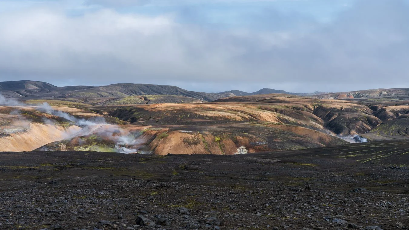  The stretch between  Landmannalaugar  and  Hrafntinnusker  is defined by scenes like this, with steaming vents rising between barren volcanic hills. 