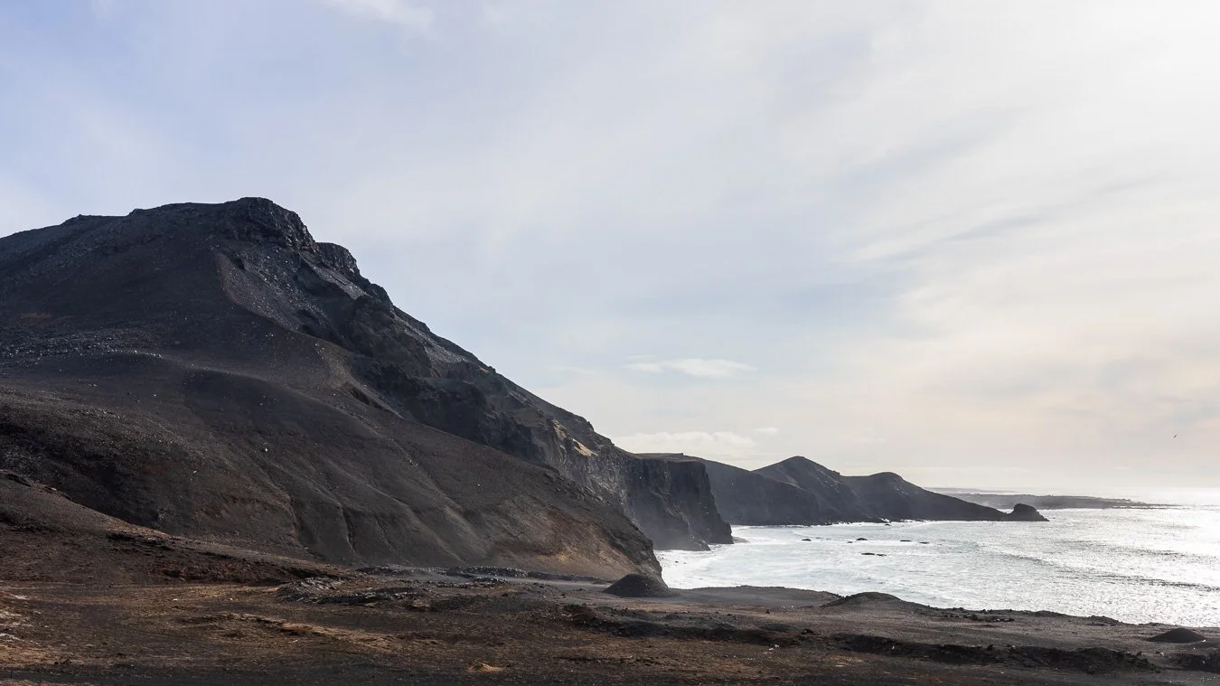 Dramatic cliffs along the route to the Fagradalsfjall volcano eruption site in southwestern Iceland.