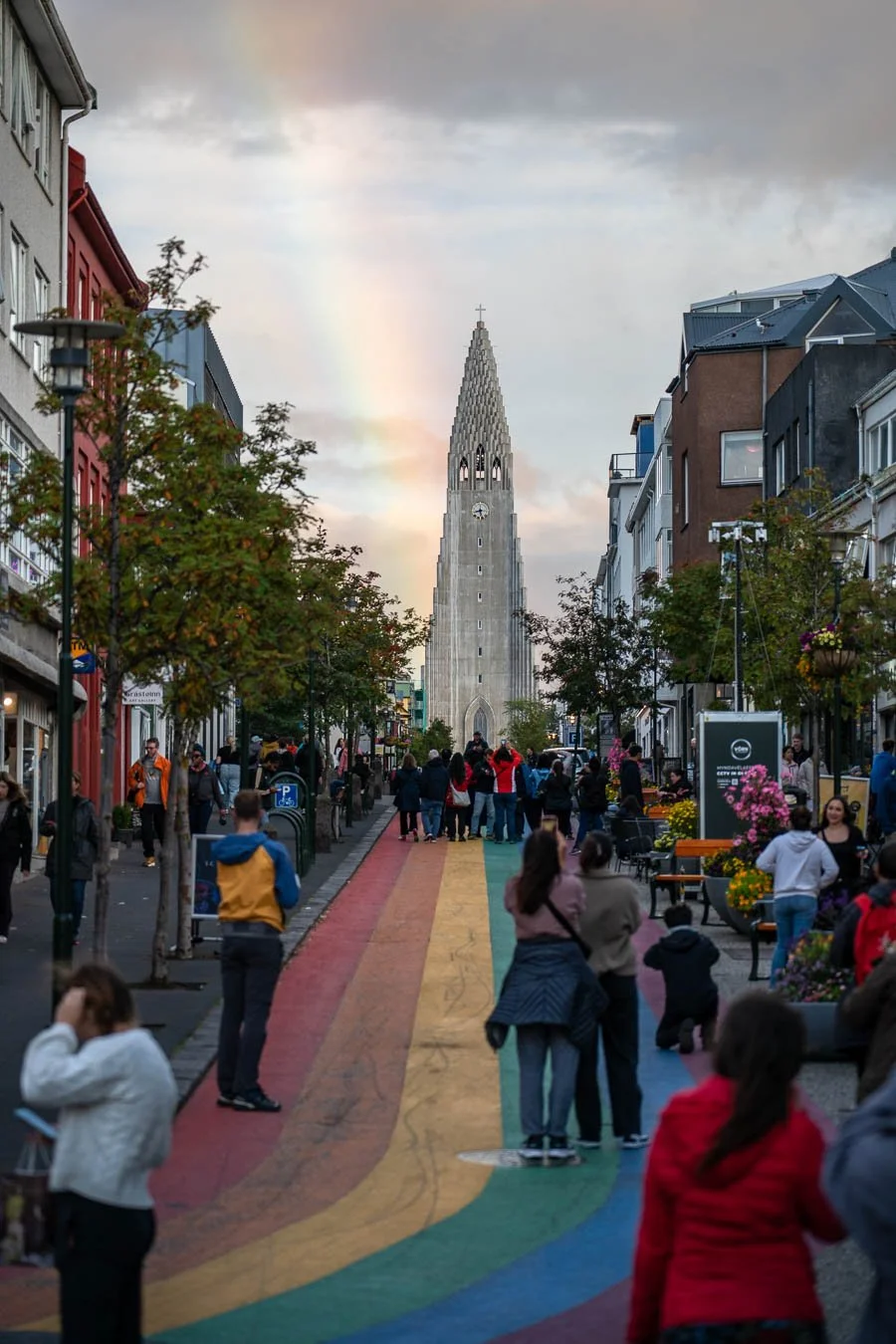 Rainbow behind Hallgrímskirkja and Rainbow Street in Reykjavík, captured on an overcast day as light broke through the clouds above the Icelandic capital.
