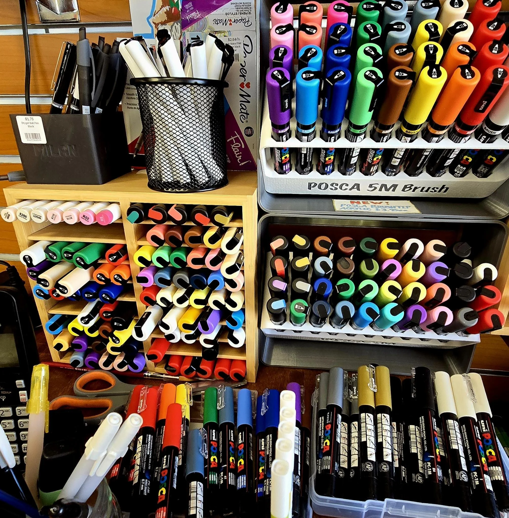 Assortment of POSCA acrylic paint pens with bullet and brush tips, plus MOPR's