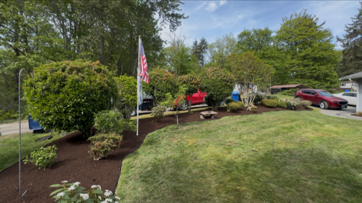 A fresh landscaping property cleanup for a realtor listing with fresh bark and trimmed bushes
