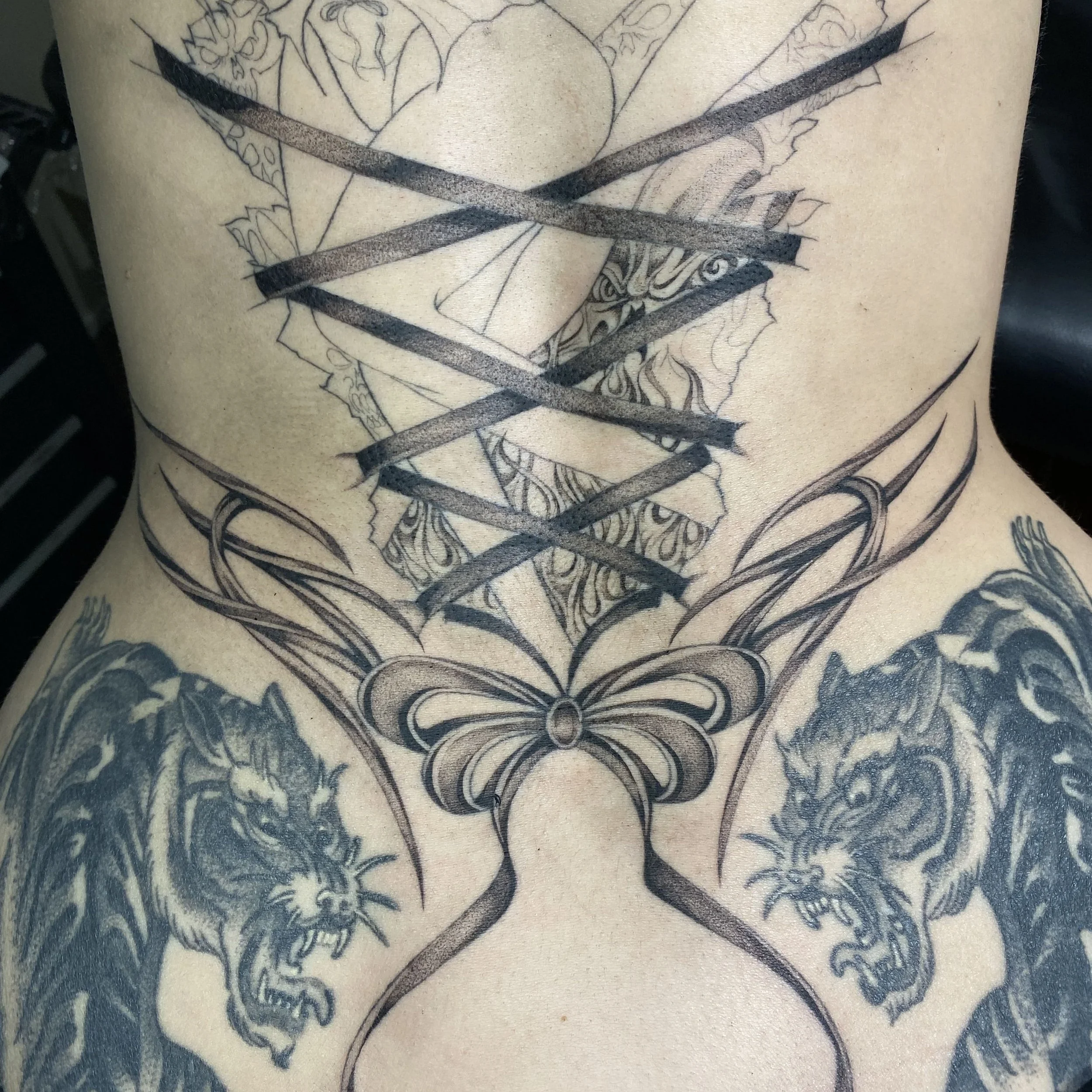 Bow Tattoo on Lower Back: A Hidden Statement