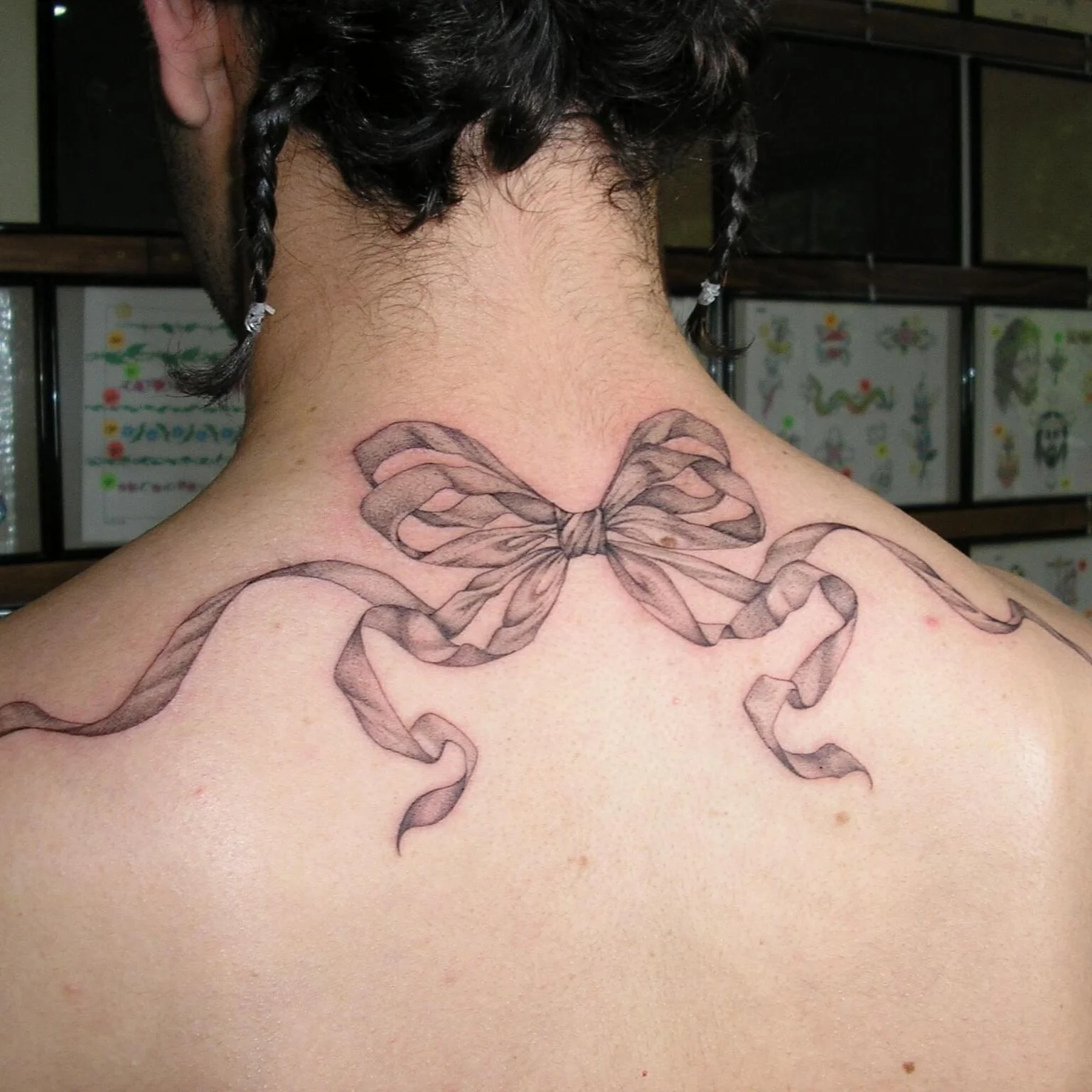 Bow Tattoo on Lower Back: Elegant & Meaningful