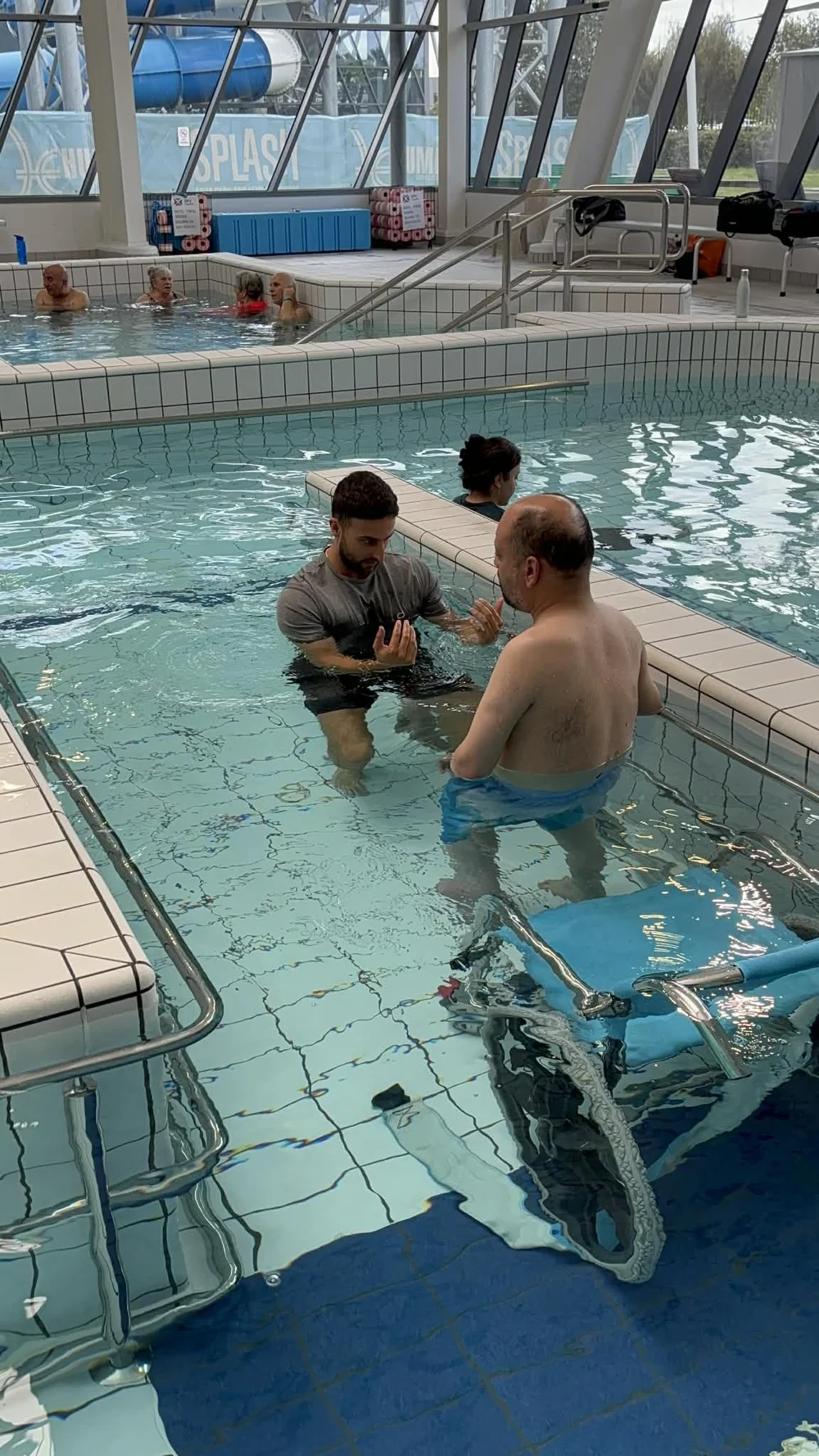 Physiotherapist in the pool with a client during hydrotherapy