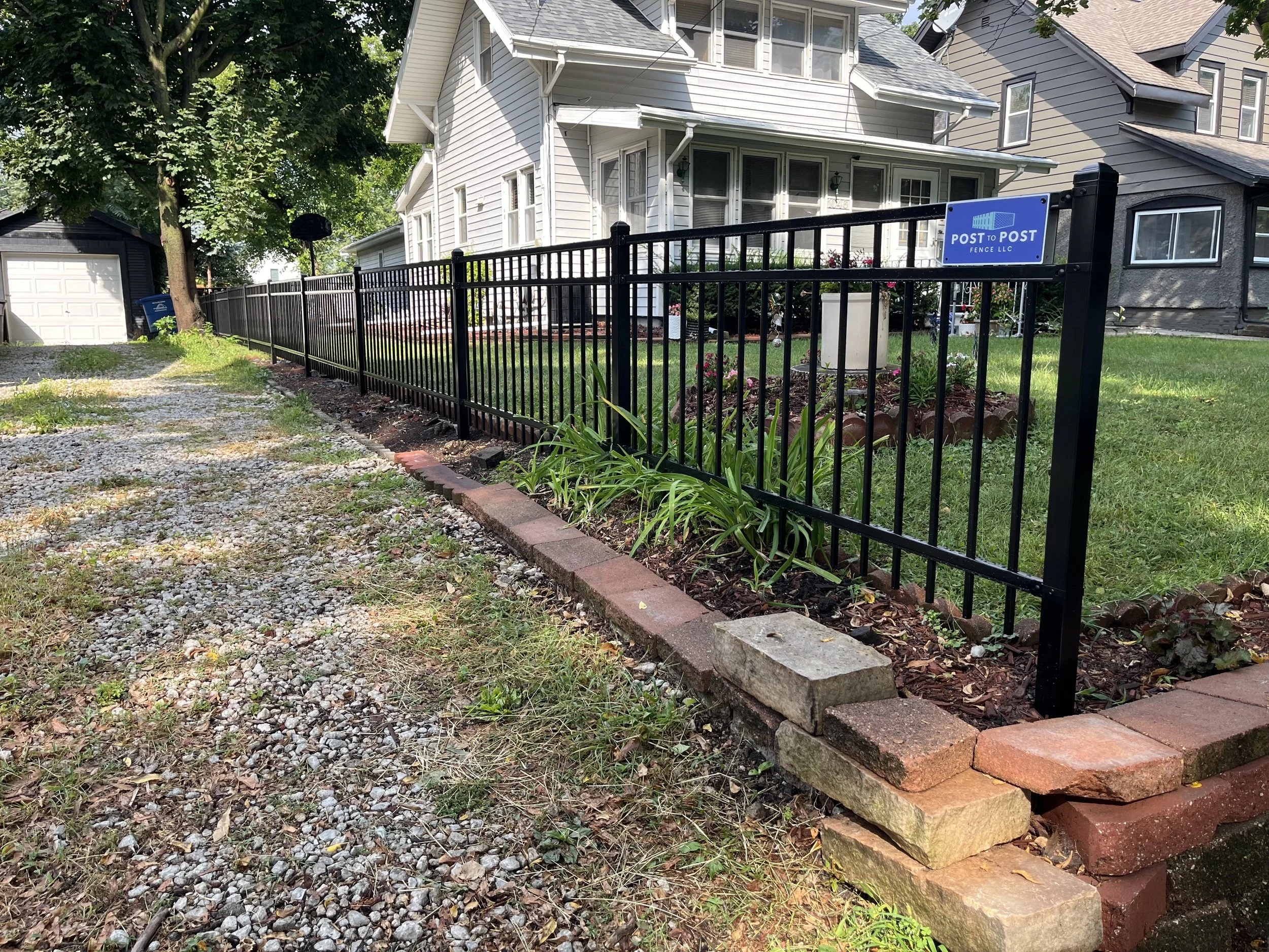 3-foot Montage three-rail ornamental fence installed in a residential front yard in Beaverdale, Iowa. This fence adds definition and curb appeal while maintaining an open, decorative look.