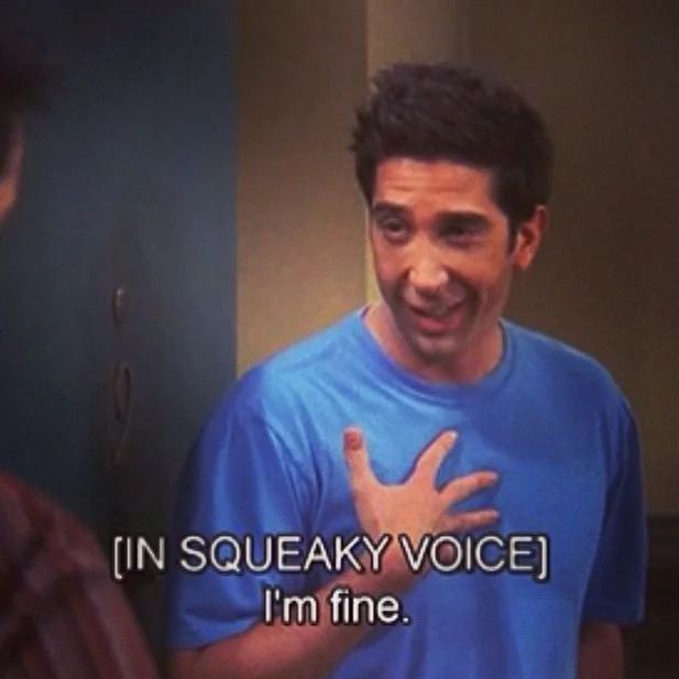 Exhausted man talking to friend. Text overlay says [in squeaky voice] "I'm fine".