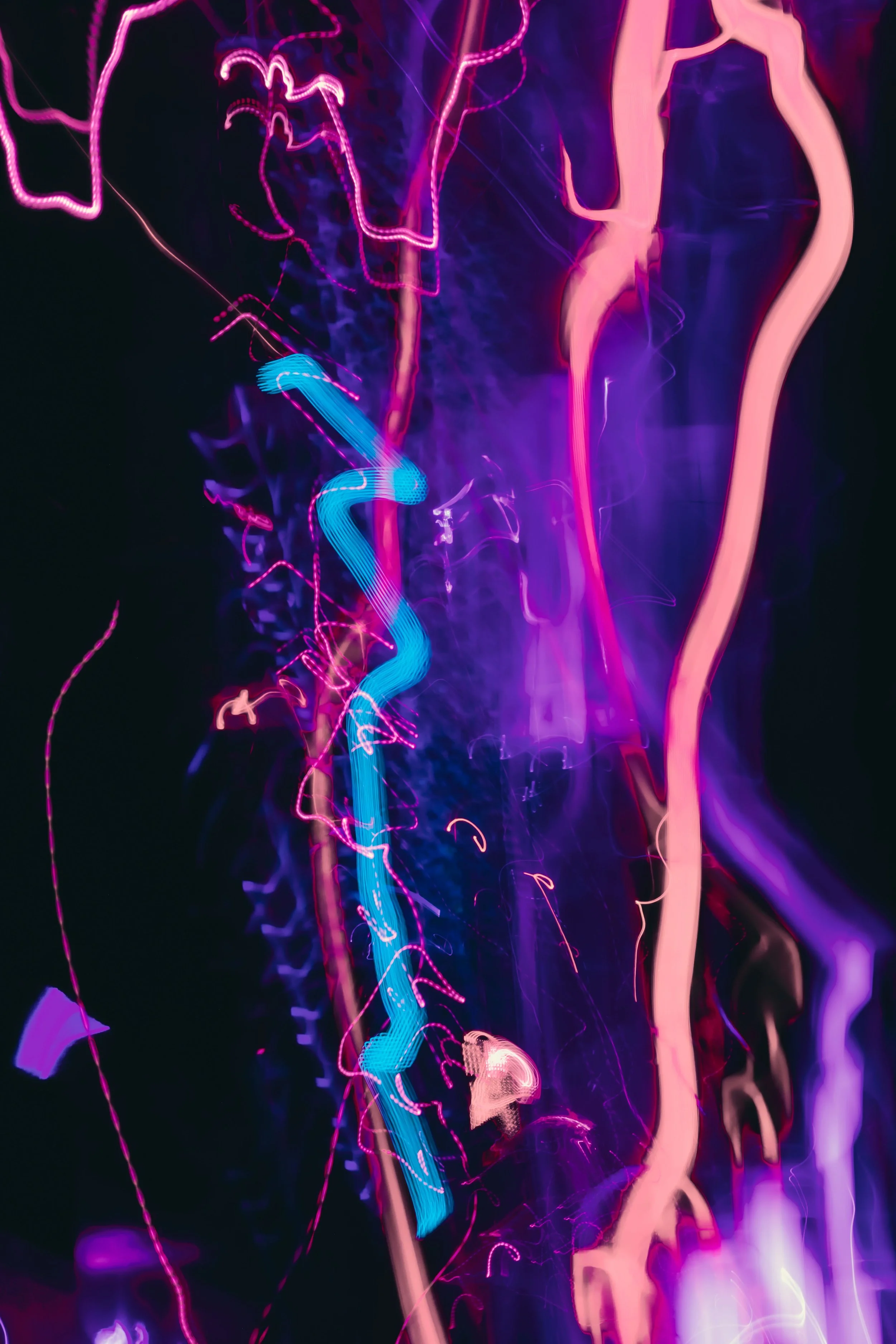 Streaks of pink and blue neon light in motion, capturing the ongoing momentum of content that never stops showing up