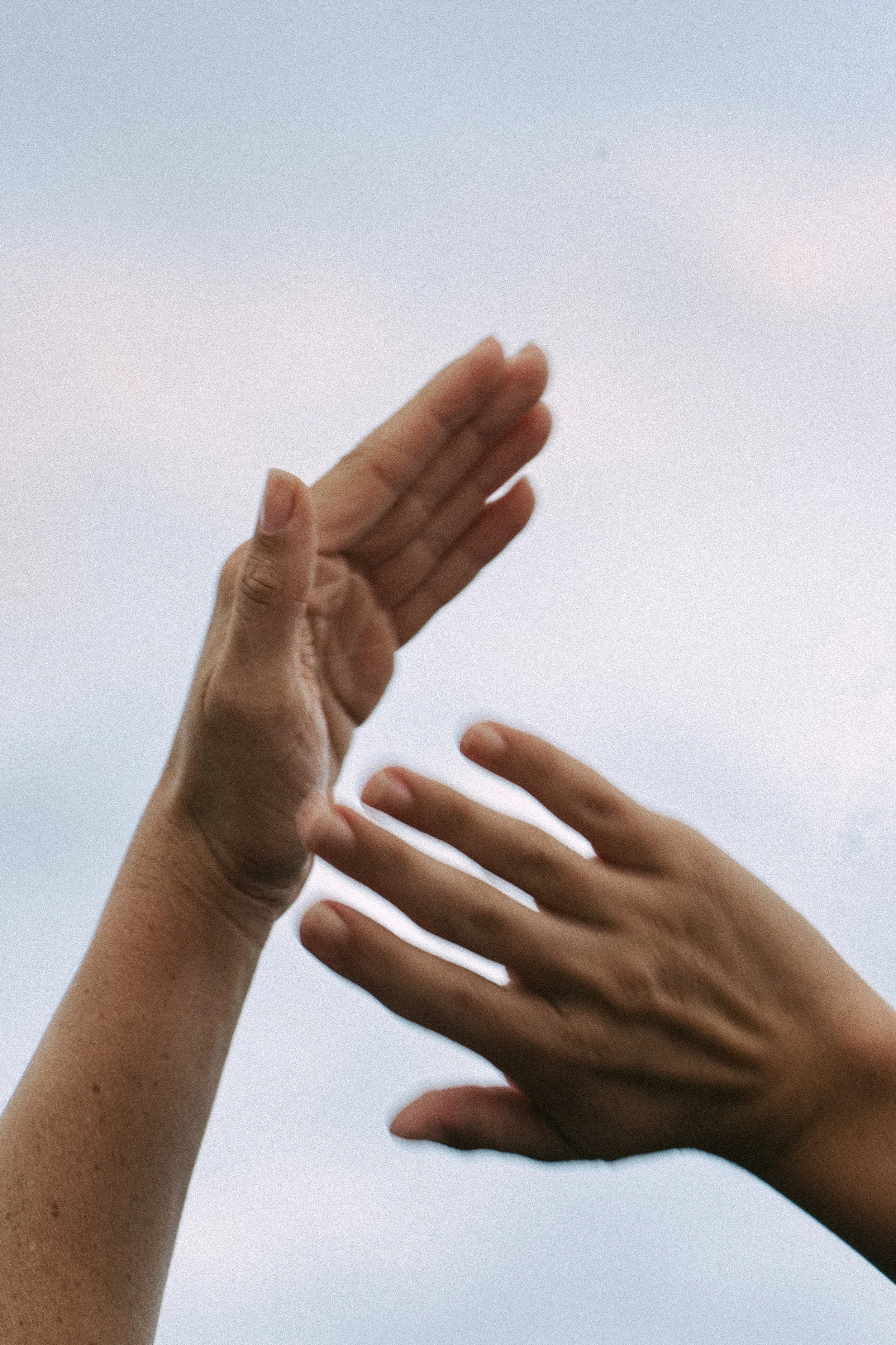Close-up of hands channeling Reiki energy with crystals, representing a healer partnered with a virtual assistant for digital product launches, content marketing, SEO, and admin support.