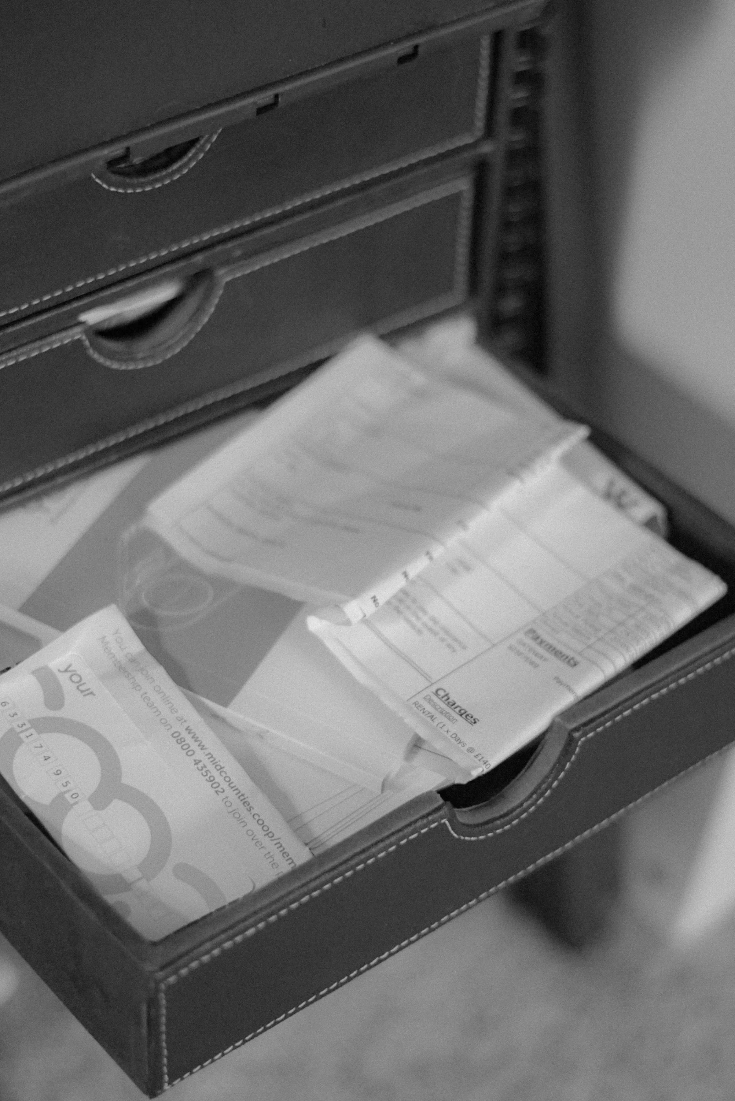 drawer of disorganized receipts and notes, representing the overwhelm that somatic coaches and energy healers feel before handing off content marketing and digital product launches to a specialized VA