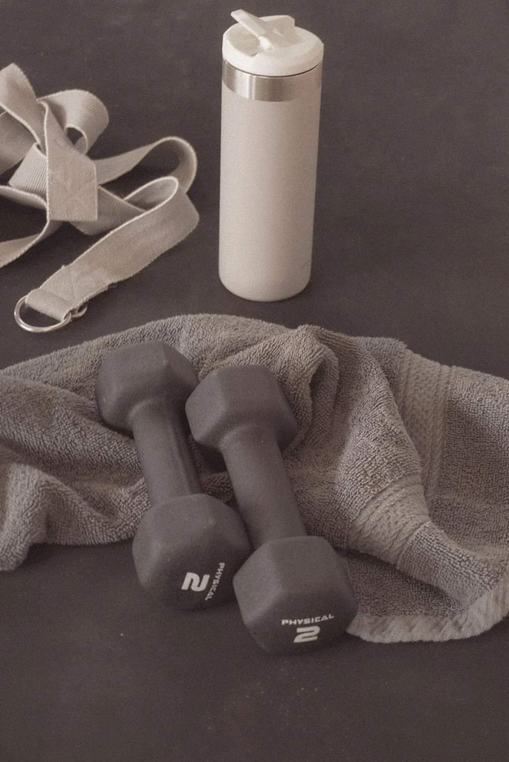 Two white ceramic bowls, one with fresh bright red raspberries and the other with white yogurt, representing nutrition-focused content created with virtual assistant support for SEO and digital product marketing.
