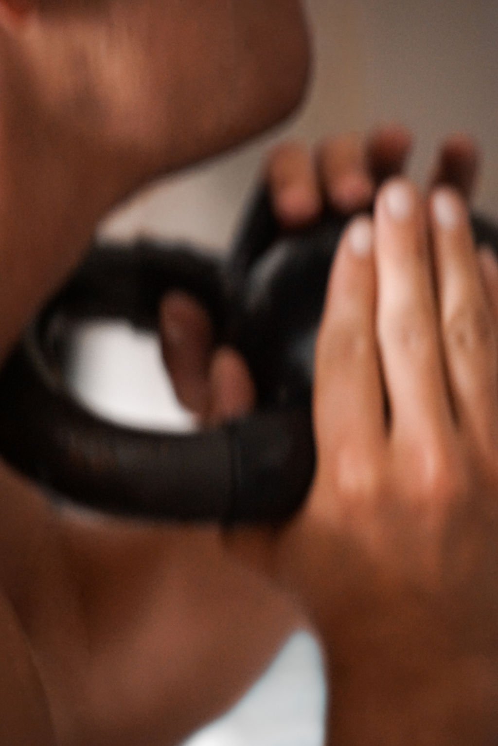 Two hands lifting a kettlebell in a personal trainer studio, representing fitness content created with virtual assistant support for digital product launches, content marketing, SEO, and admin services for movement-based professionals