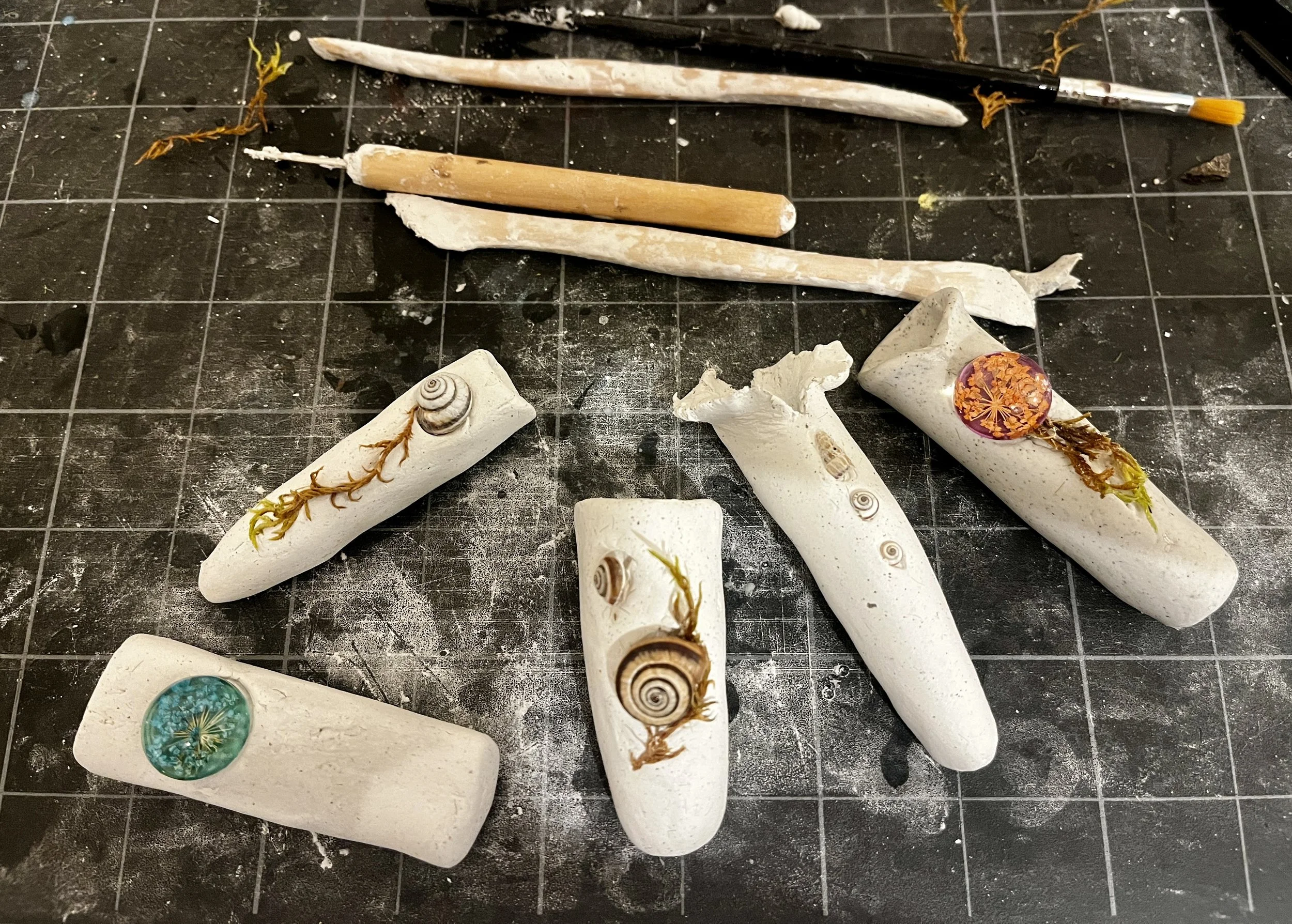 Assortment of bud vases used with materials scavenged from the island