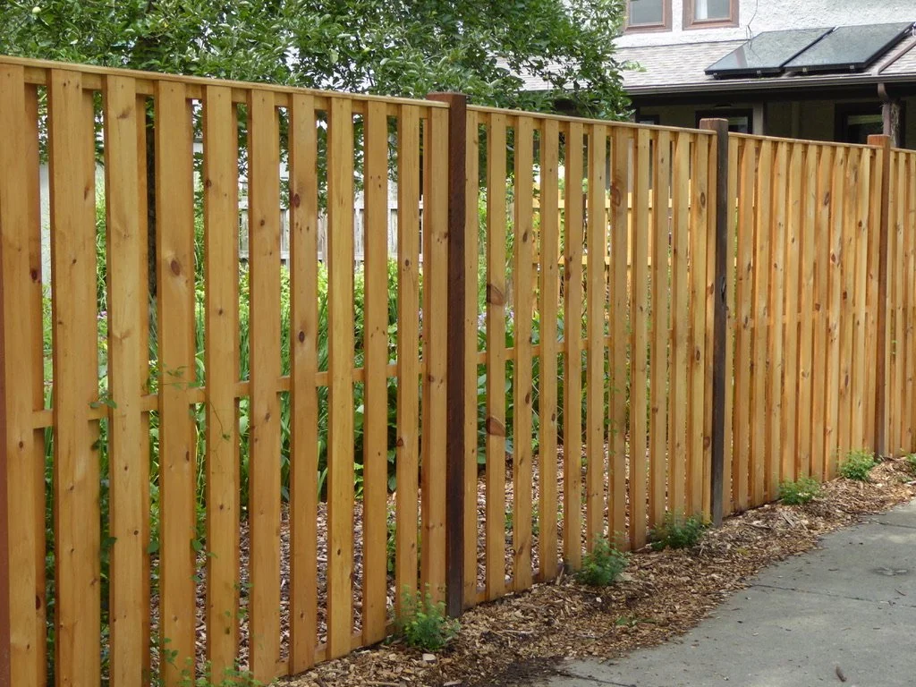 Wooden fence providing privacy for a beautiful garden in Ithaca, NY