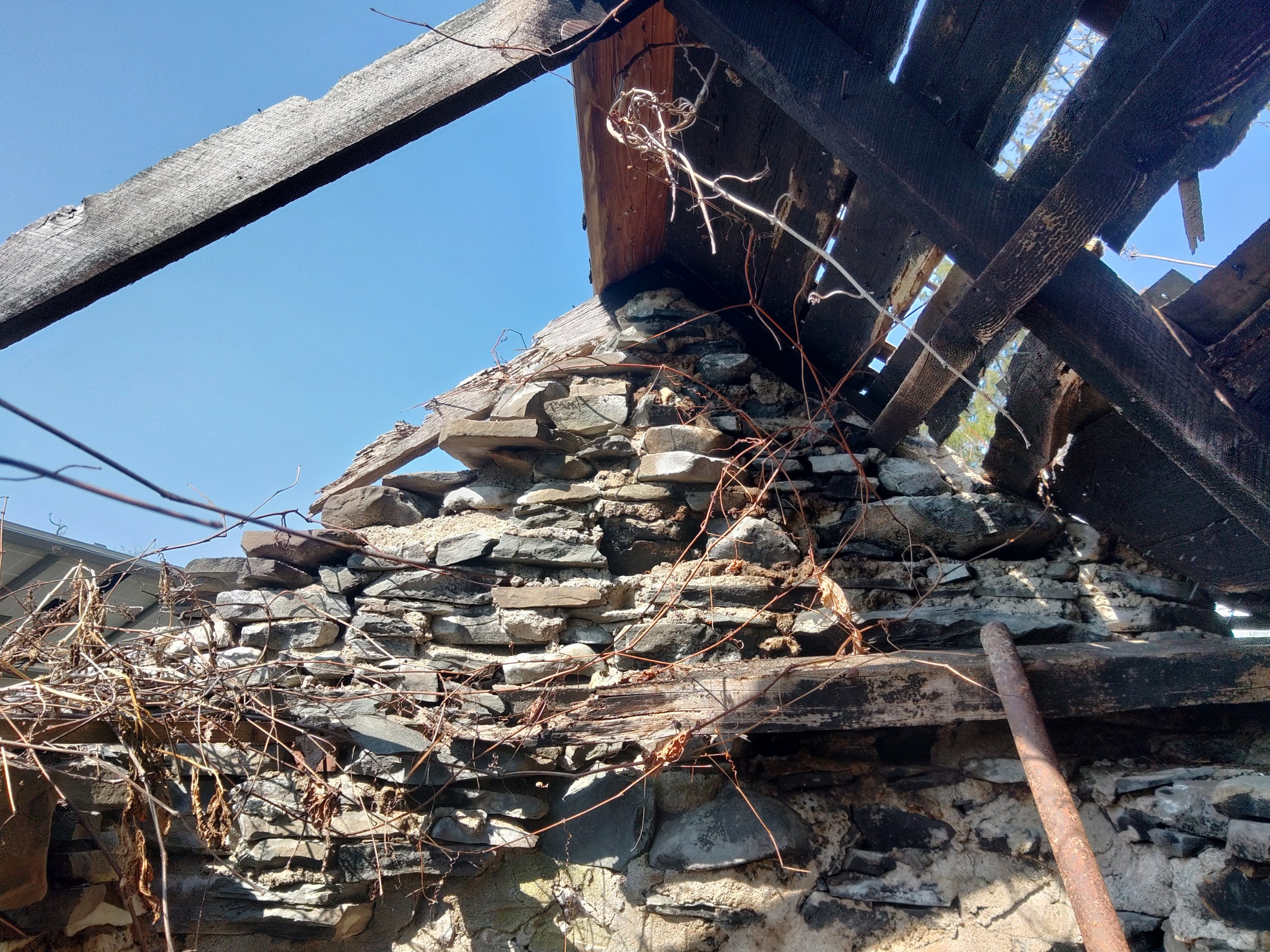 Historic stone smoke house in need of restoration.