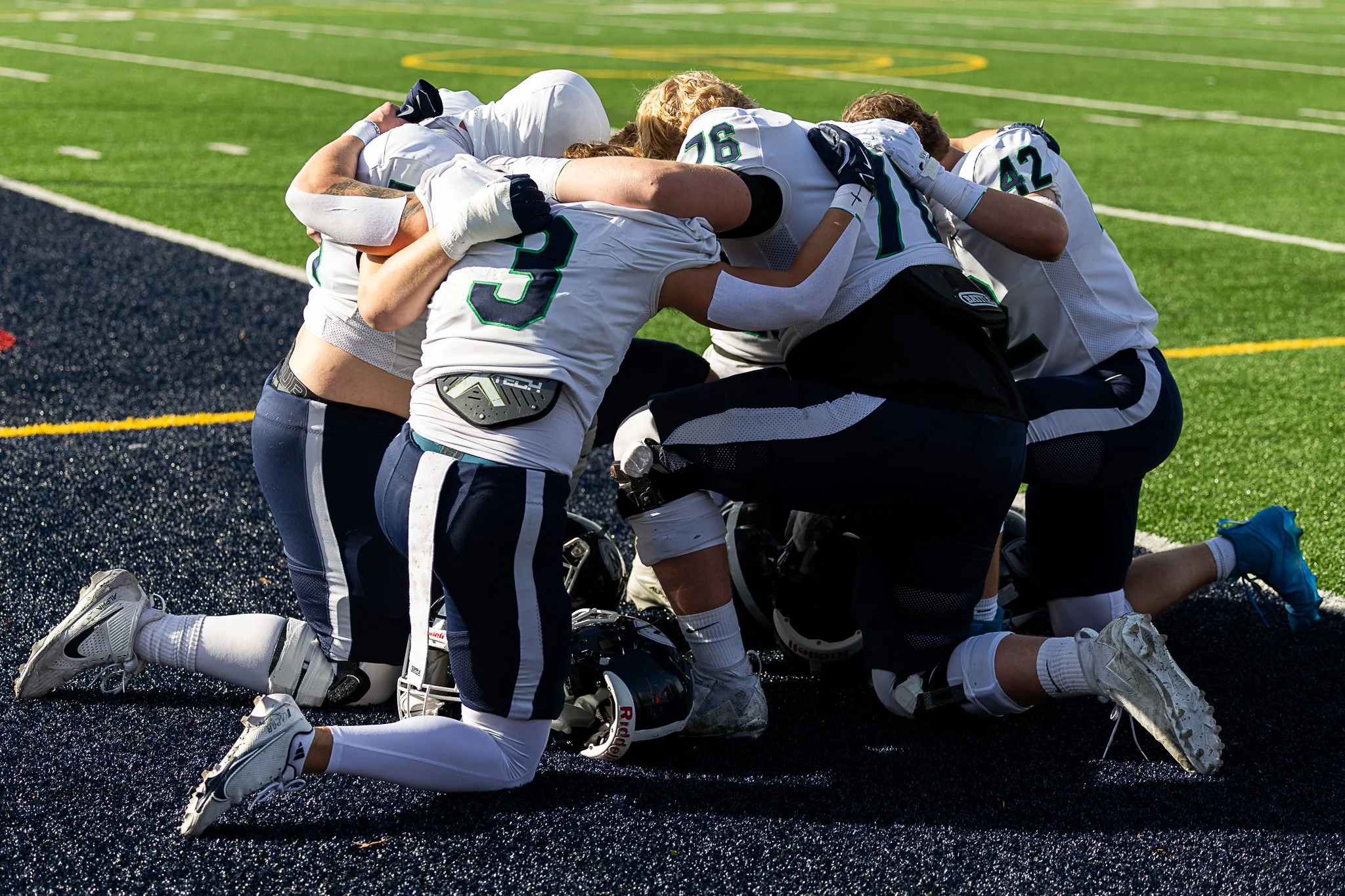 Williston players huddle prior to kickoff against Avon Old Farms at the NEPSAC Drew Gamere Bowl in Avon, CT, on November 15, 2025.