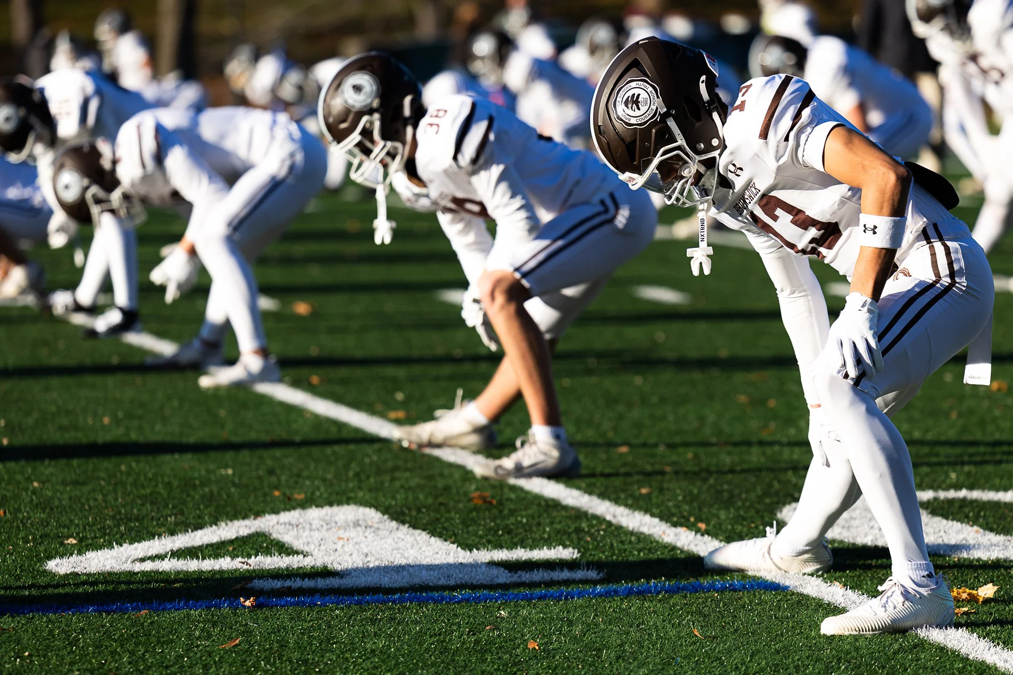 Brunswick players stretch prior to kick off in the game against Williston at Sawyer Field on November 8, 2025. 